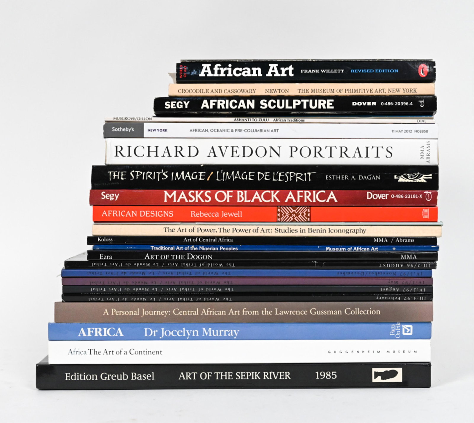 GROUPING OF BOOKS INCL. AFRICAN ART: Grouping of books primarily with African art subjects. Including Masks of Black Africa, Richard Avedon Portraits, African Sculpture, etc. Dimensions: (Stack) H 10.5" x W 12.5" x D 10.5" Condition: Wea