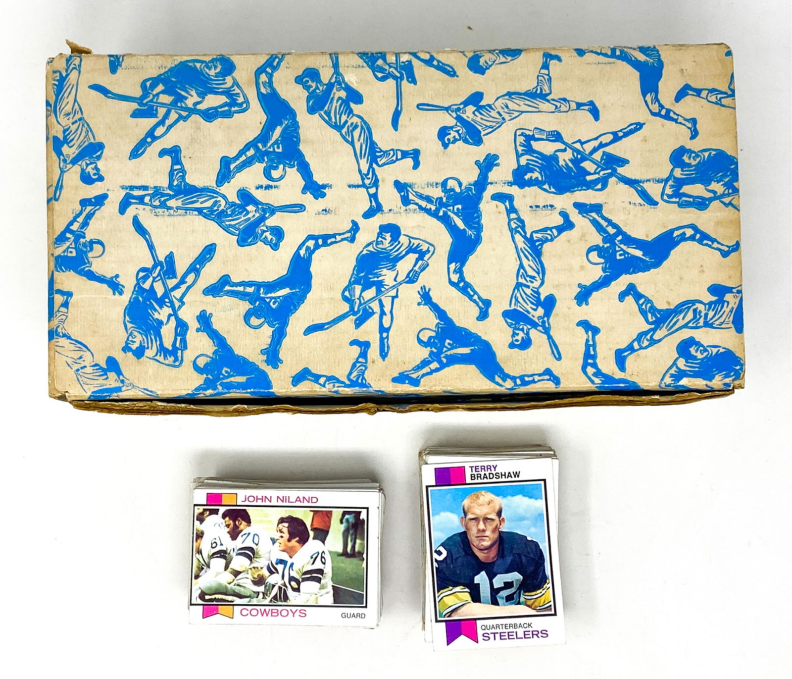 COLECTION OF 1973 TOPPS FOOTBALL CARDS: Including (750+) cards from the 1973 Topps collection. Partially sorted into teams. Including players such as Terry Bradshaw, Joe Greene, George Atkinson, etc. Some duplicates included. Dimensions: H