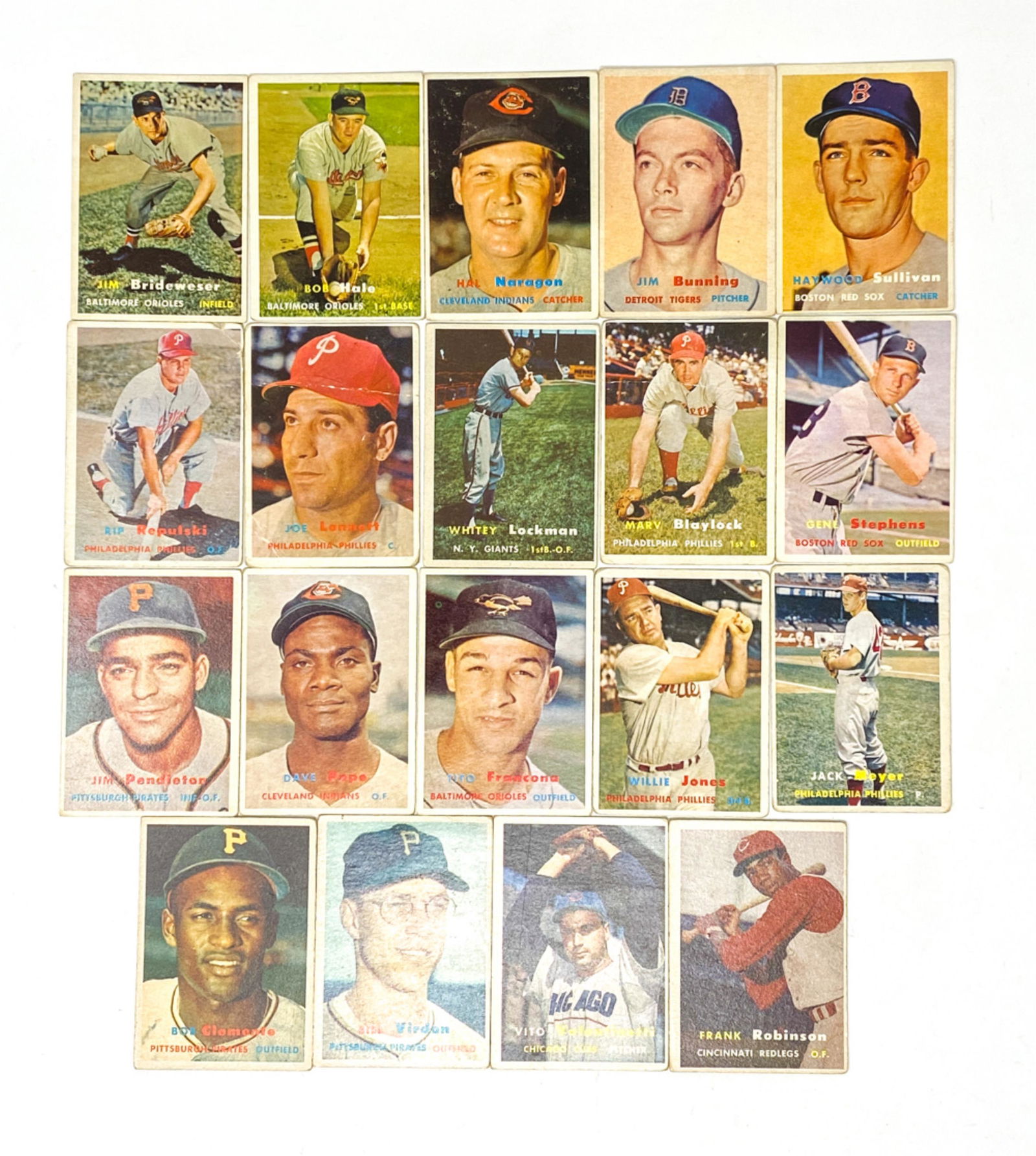 COLLECTION OF 1957 TOPPS BASEBALL CARDS: Including (15+) cards from the Topps 1957 series. With players such as Bob Clemente, Frank Robinson, Whitey Lockman, Jim Pendleton, etc. Dimensions: H 3.5" x W 2.5" Condition: Cards in various stages