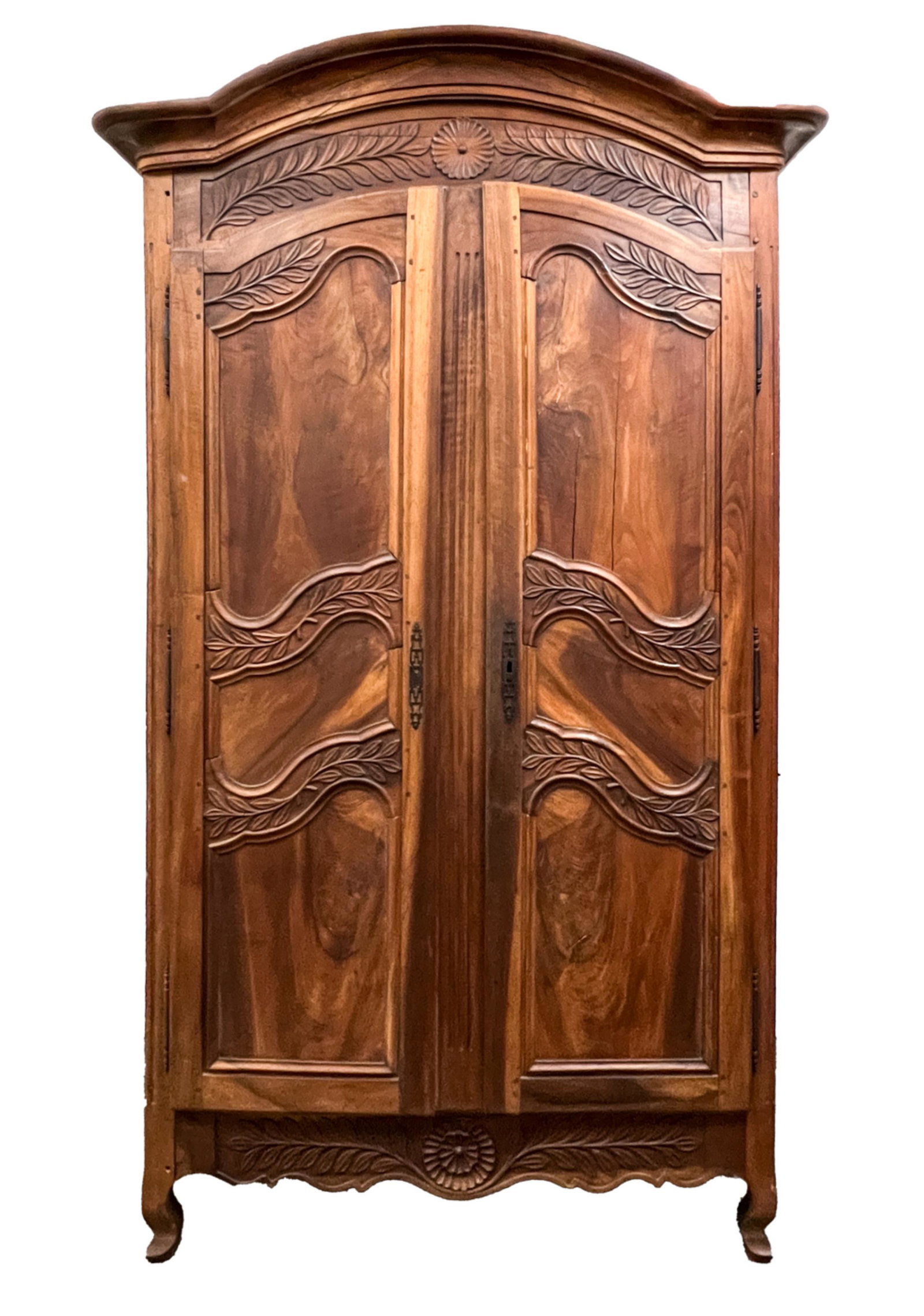 18TH C. FRENCH PROVINCIAL ARMOIRE, AS BAR CABINET: A rare Louis XV period carved armoire with bold floral motifs, masterfully converted into an illuminated bar cabinet, featuring a counter-height workspace resting atop the two original dovetailed draw
