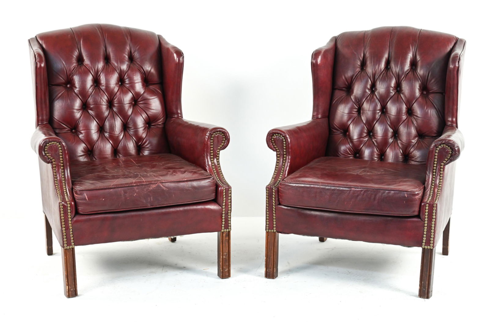 PAIR OF BONDED LEATHER TUFTED WINGBACK ARMCHAIRS (1 of 18)