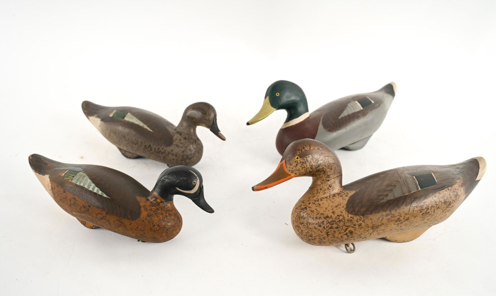 (4) CHESAPEAKE DUCK DECOYS ATTR. CPT. HARRY JOBES: (4) 20th Century Chesapeake Bay duck decoys attributed to Captain Harry Jobes of Maryland. Includes: Mallard drake and hen; Blue-Winged Teal drake and hen. Dimensions: (largest) H 8.5" x W 16" x D 6.5