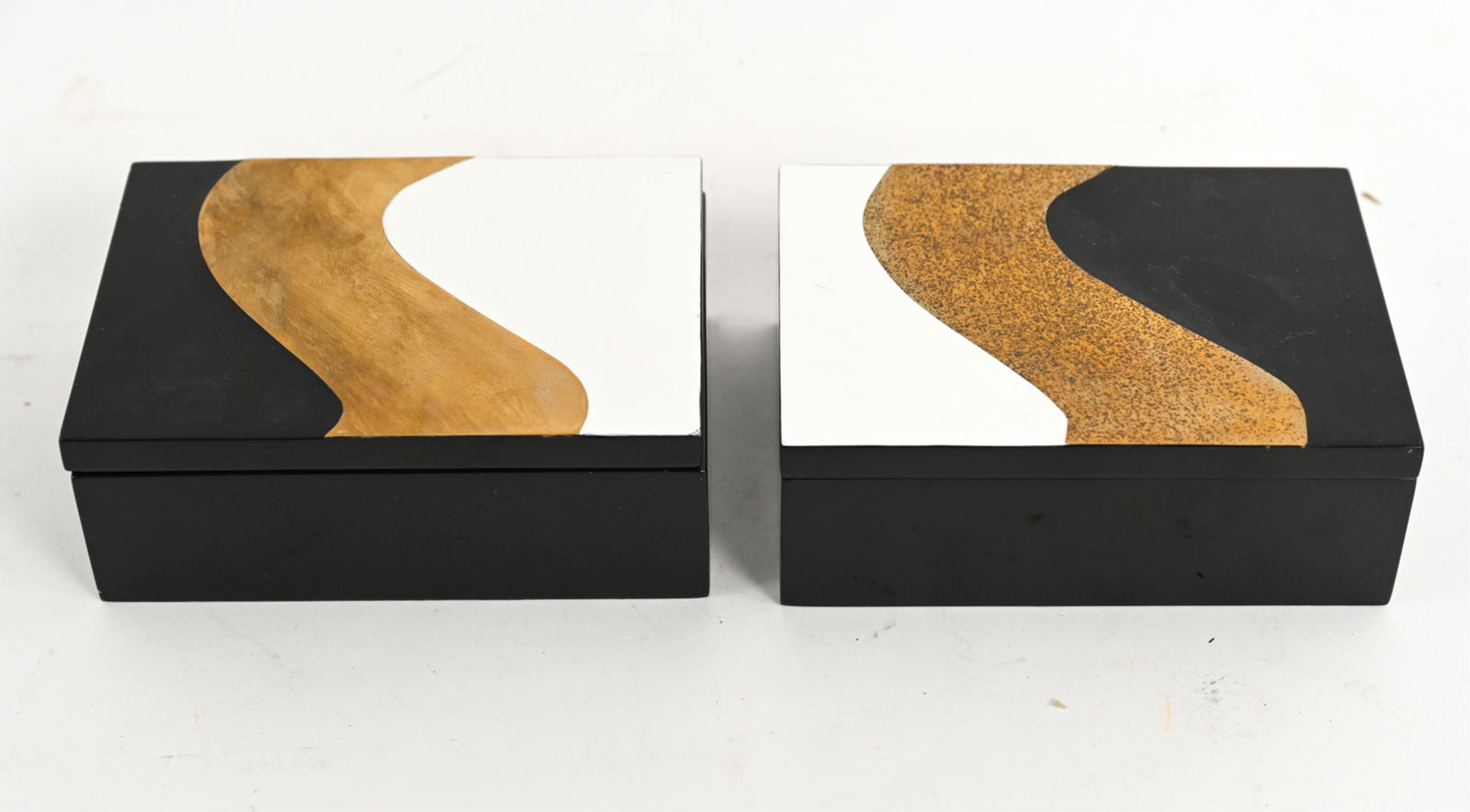 (2) CONTEMPORARY FLAIR LACQUERED BOXES: (2) contemporary black and white lacquer and brass decorative boxes, marked underneath "Flair." Dimensions: H 2.5" x W 7" x D 5" Condition: Pitting to brass. Few small nicks to lacquer.