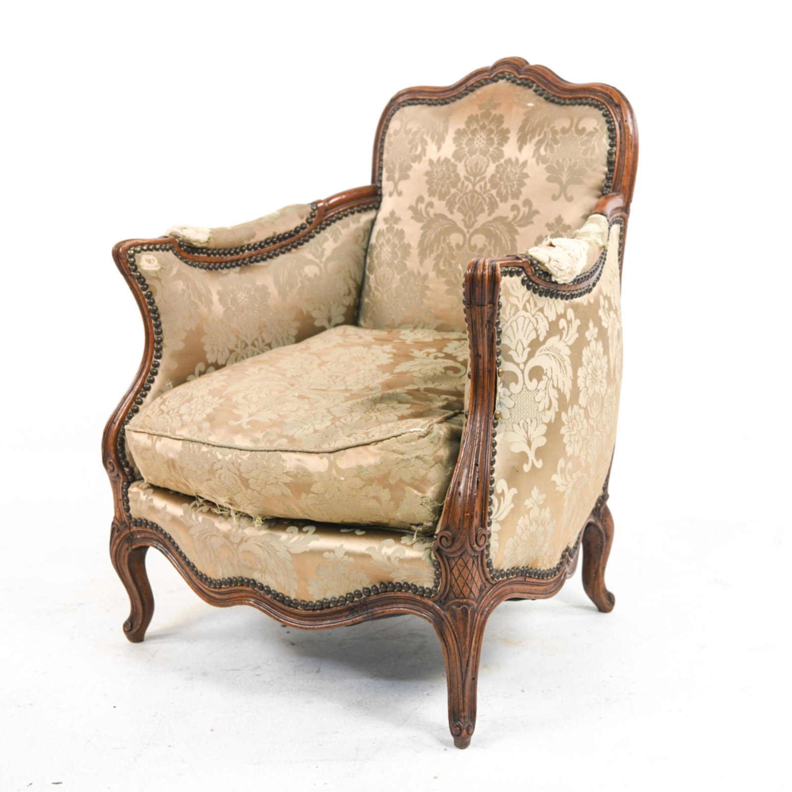 FRENCH BERGERE CHAIR: Dimensions: H 33.5" W 28" x W 24", SH: 17" Condition: Overall significant wear to the entire chair. Upholstery on arms is gone and padding is exposed. Seating cushion has a hole in it. Chair is a good