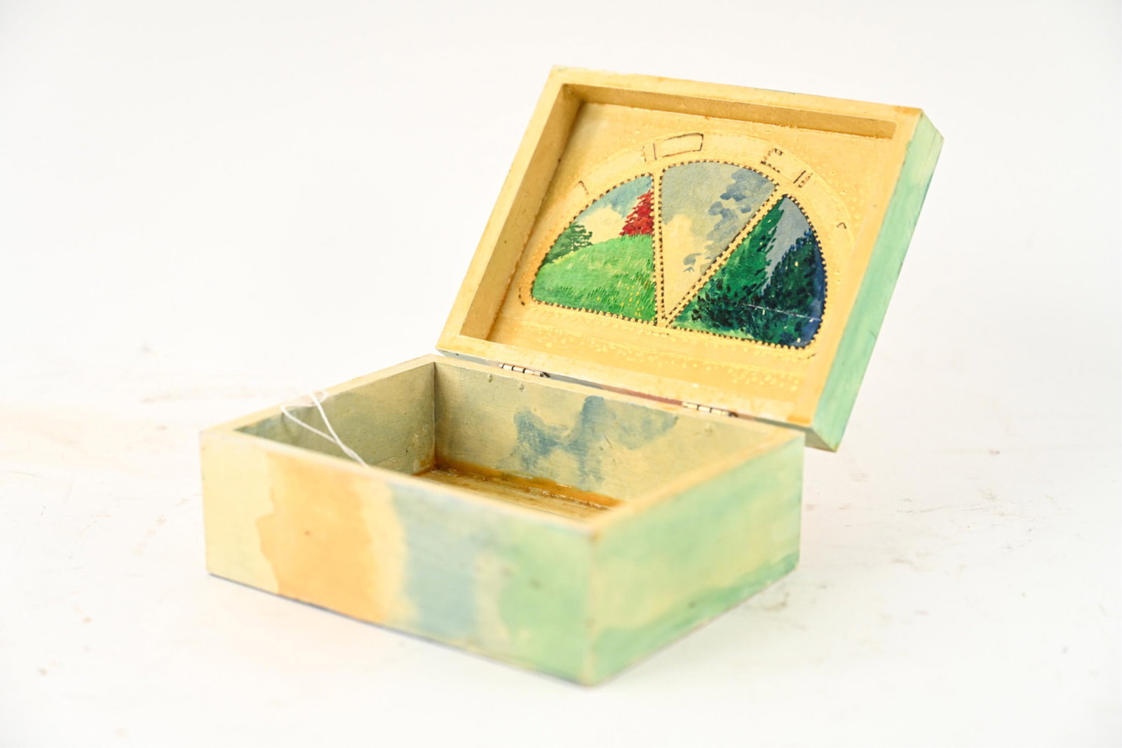 DONNA MARXER (1934-2019) PAINTED WOOD BOX: Titled "Irish Window" Signed underneath. Dimensions: H 3" x W 7" x D 5" Condition: Some stains and losses to paint. Immortalized by the New York Times as an "artist, poet, activist, and humanist", Don