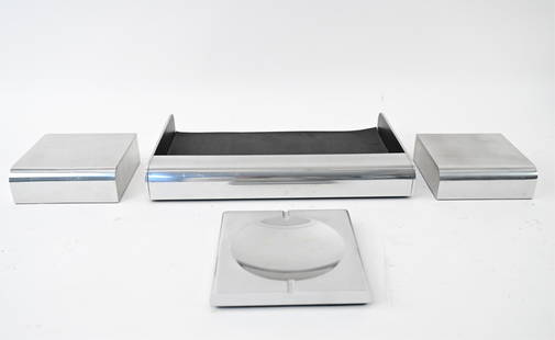 WILLIAM SKLAROFF RADIUS TWO DESK GROUPING: Including model Radius Two desk tray, pair of bookends, and ashtray designed by William Sklaroff. Dimensions: (Desk tray) H 2" x W 16" x D 10.5" Condition: Signs of age and use including scratches, fe