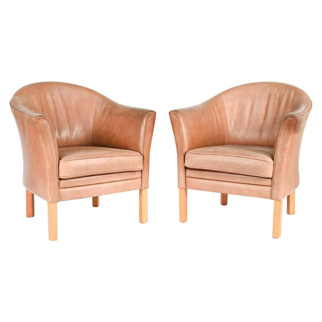 PAIR MOGENS HANSEN DANISH MID-CENTURY ARMCHAIRS: A pair of Danish mid-century armchairs by Mogens Hansen upholstered in leather. Dimensions: H 32.5" x W 29" x D 27" x SH 17.5" Condition: Wear consistent with age and use. Handsome patina to leather i