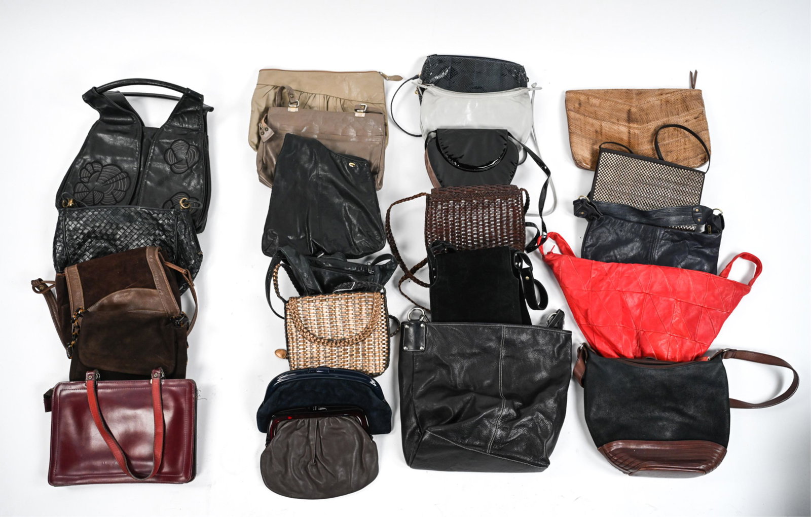 LARGE GROUPING OF VINTAGE LEATHER BAGS: Grouping of (23) quality leather handbags dating from the 1980's - Early 2000's, including (2) crossbody clutch bags by Charles Jourdan; an asymmetrical sling bag by DKNY; a rare Kenneth Cole black le