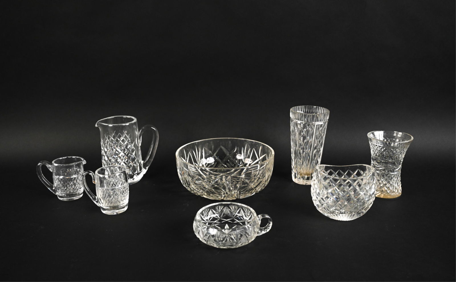 WATERFORD CUT CRYSTAL VASES & SERVEWARE: Including a water pitcher, (2) creamers, and envelope vase - all marked Waterford; plus several other fine quality pieces. Dimensions: (Largest, fruit bowl) H 4" x Dia. 10" Condition: In very good vin