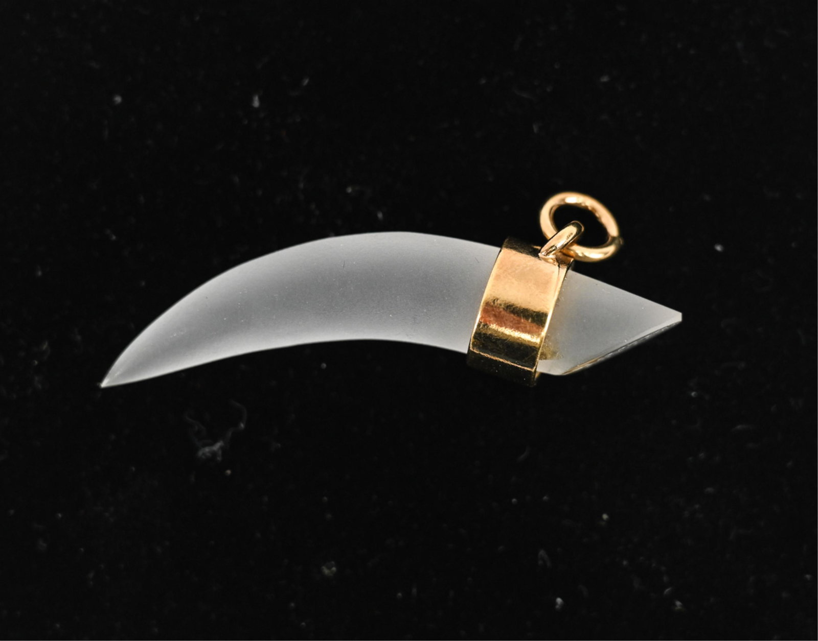 DAUM CRYSTAL HORN PENDANT: Frosted glass with gold-tone accents, signed. Dimensions: L 2.25" x W .5" Condition: Chip near the gold-tone banding. Only minor surface rubs.