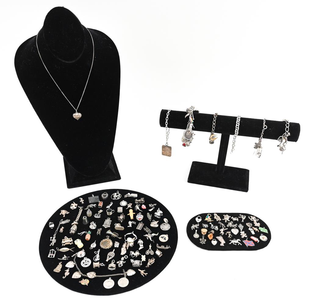 GROUPING OF STERLING SILVER CHARMS & BRACELETS: Large grouping of vintage/estate charms and charm bracelets. Many interesting, moveable and unique charms. Mostly all sterling silver, very few non silver charms. Weight: 15 ozt Condition: As shown, m