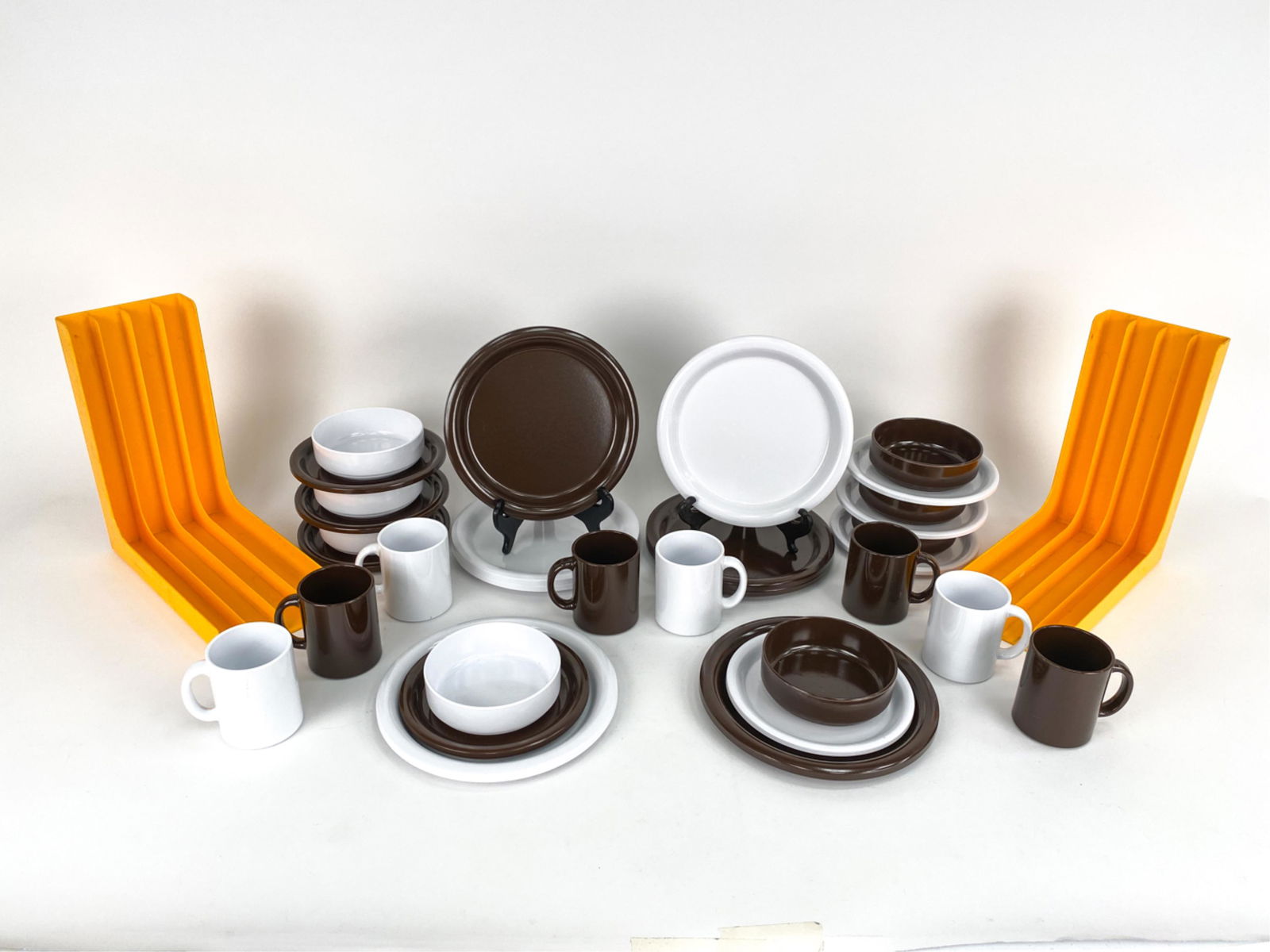 GROUPING OF VINTAGE 70S PLASTIC: Pair of coveted vintage 70's Gustavsberg record holders Made in Sweden. They hold approximately 40 albums in the 4 slots. Impressed makers mark under. Set of vintage brown & white Ingrid Ltd. plastic