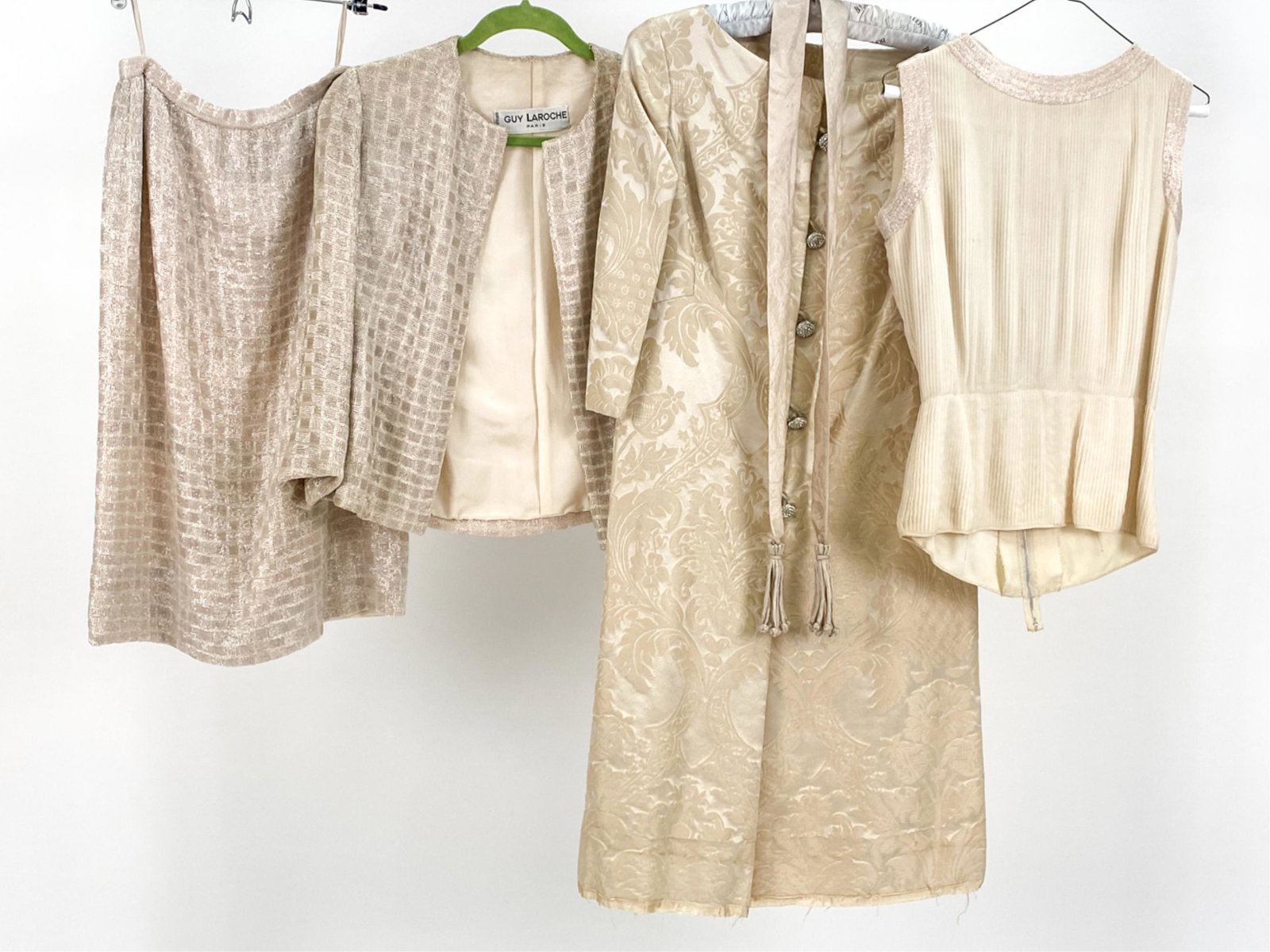 VINTAGE GUY LAROCHE & TEAL TRAINA CLOTHING: Including Teal Traina dress and Guy Laroche beaded jacket and skirt set. No sizes given, approx. 4-6. Condition: Few loose beads. Fraying to bottom of dress. Few light areas of soiling.