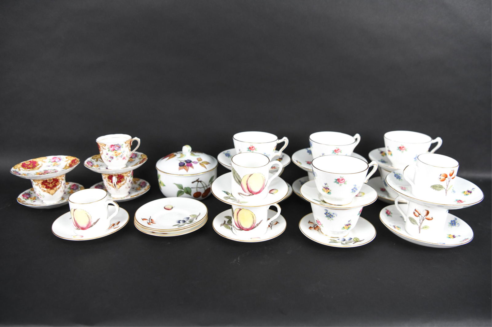 GROUPING OF ENGLISH BONE CHINA & PORCELAIN: Grouping of vintage and antique porcelain teaware, mostly bone china, including: (8) footed teacups with (8) saucers from the Rose Pansy pattern by Crown Staffordshire; (3) demitasse cups and (3) sauc