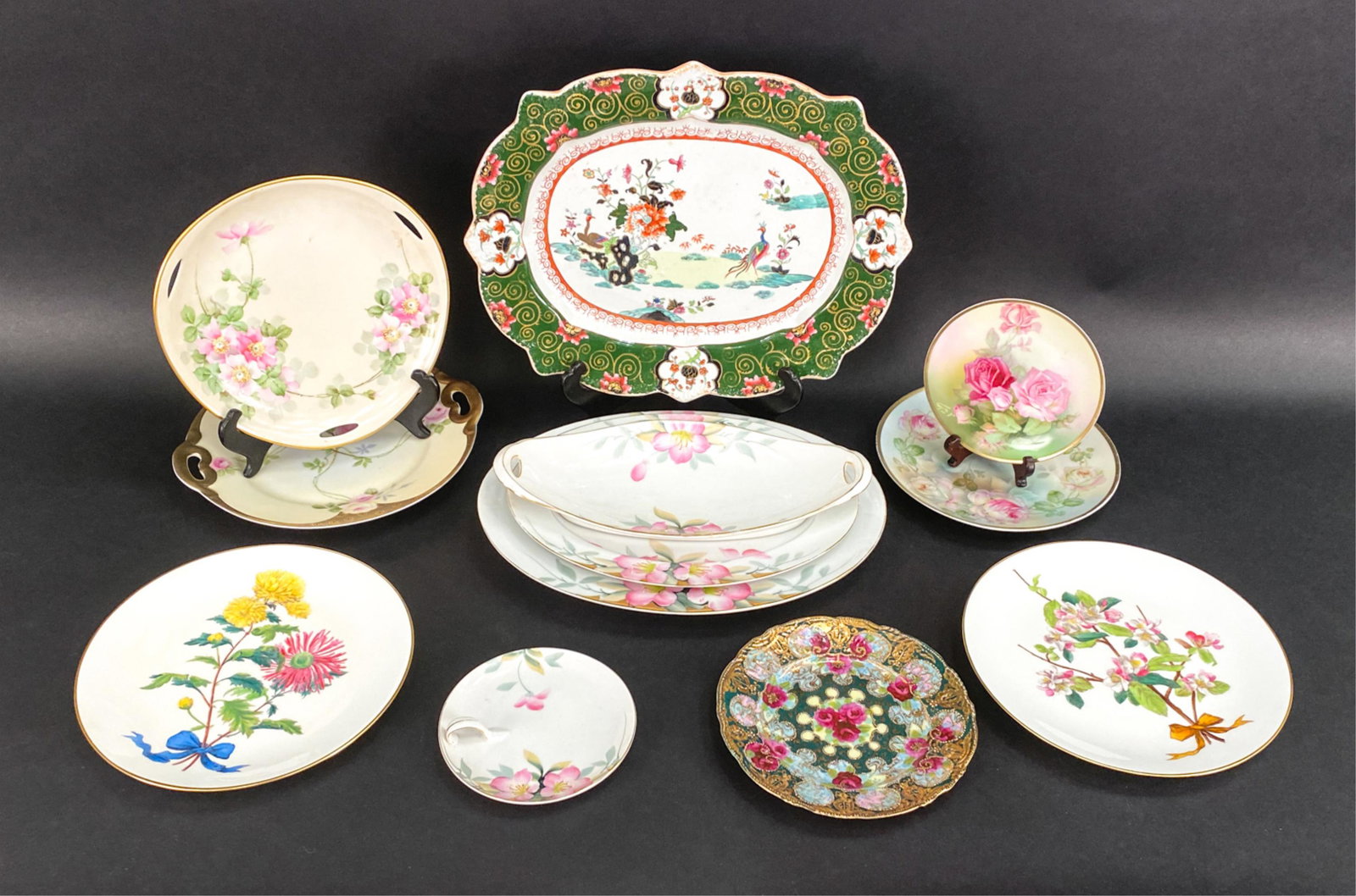(12) ANTIQUE/VINTAGE FLORAL DECORATED PORCELAIN: Including two Minton 9.5" plates, Bavaria, one Nippon, Chinese platter, etc. Dimensions: (Largest) L 15" x W 11" Condition: Some rubbing to gold.