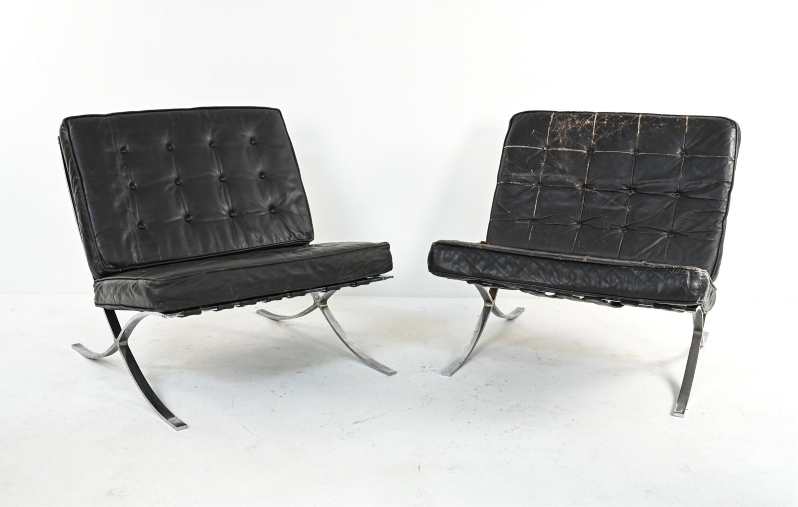 PAIR SELIG BARCELONA-STYLE LOUNGE CHAIRS, 1960'S: Pair of genuine Mid-Century lounge chairs in chrome and leather, produced by Selig after the iconic design by Ludwig Mies van der Rohe and Lilly Reich. Stamped Industria Argentina on feet. Dimensions: