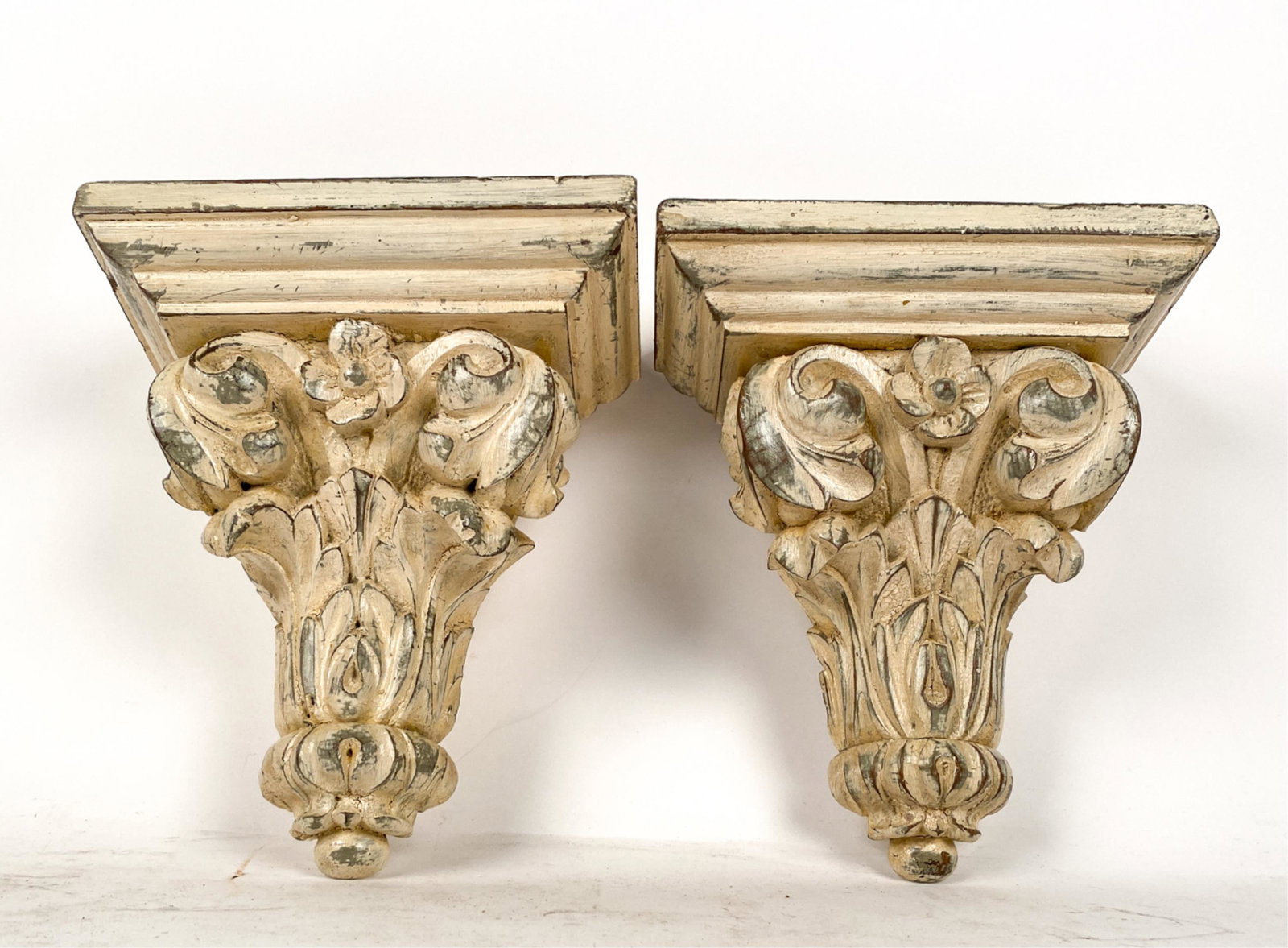 PAIR OF CONTEMPORARY WOODEN DECORATIVE CORNICES: Dimensions: H 9.5" x W 7.5" x D 4" Condition: Intentionally distressed paint finish. Showing light wear consistent with age and use.