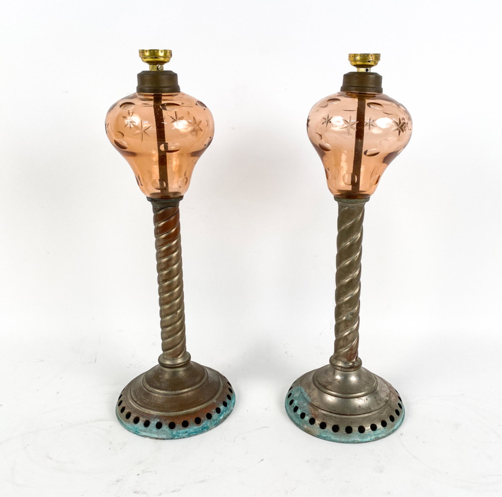 PAIR OF ANTIQUE OIL LAMPS: Pair has no electrical wiring. Dimensions: H 18" x W 6.5" x D 6.5" Condition: Patina to the bronze sections of the lamps. Wear is consistent with age and use.
