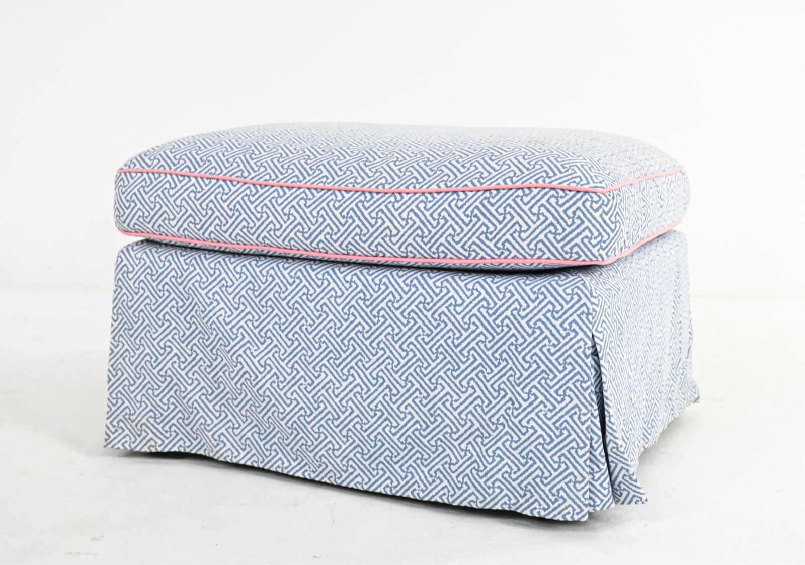 SKIRTED OTTOMAN ON CASTERS: Dimensions: H 20" x W 30" x D 20" Condition: There is mild soiling to the upholstery and a small stain to the front edge. Wear is consistent with age and use.
