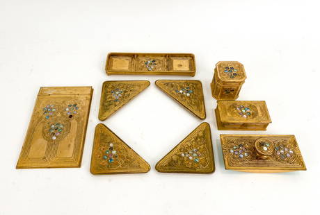 TIFFANY STUDIOS ABALONE DESK SET: Gilt bronze with abalone inlay. Marked Tiffany Studios underneath. Including inkwell, rocking blotter, blotter ends, box, dish, and notepad cover. Dimensions: (Largest) H 7.75" x W 5" Condition: