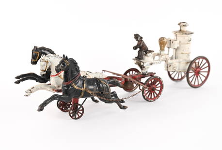 ANTIQUE CAST IRON HORSE-DRAWN FIRE PUMPER TOY: Rare horse-drawn fire pumper steam engine toy in cold painted cast iron, with horses that gallop as the toy moves. Attributed to Dent Hardware Co. Dimensions: (Together) H 8" x L 22" x W 7"