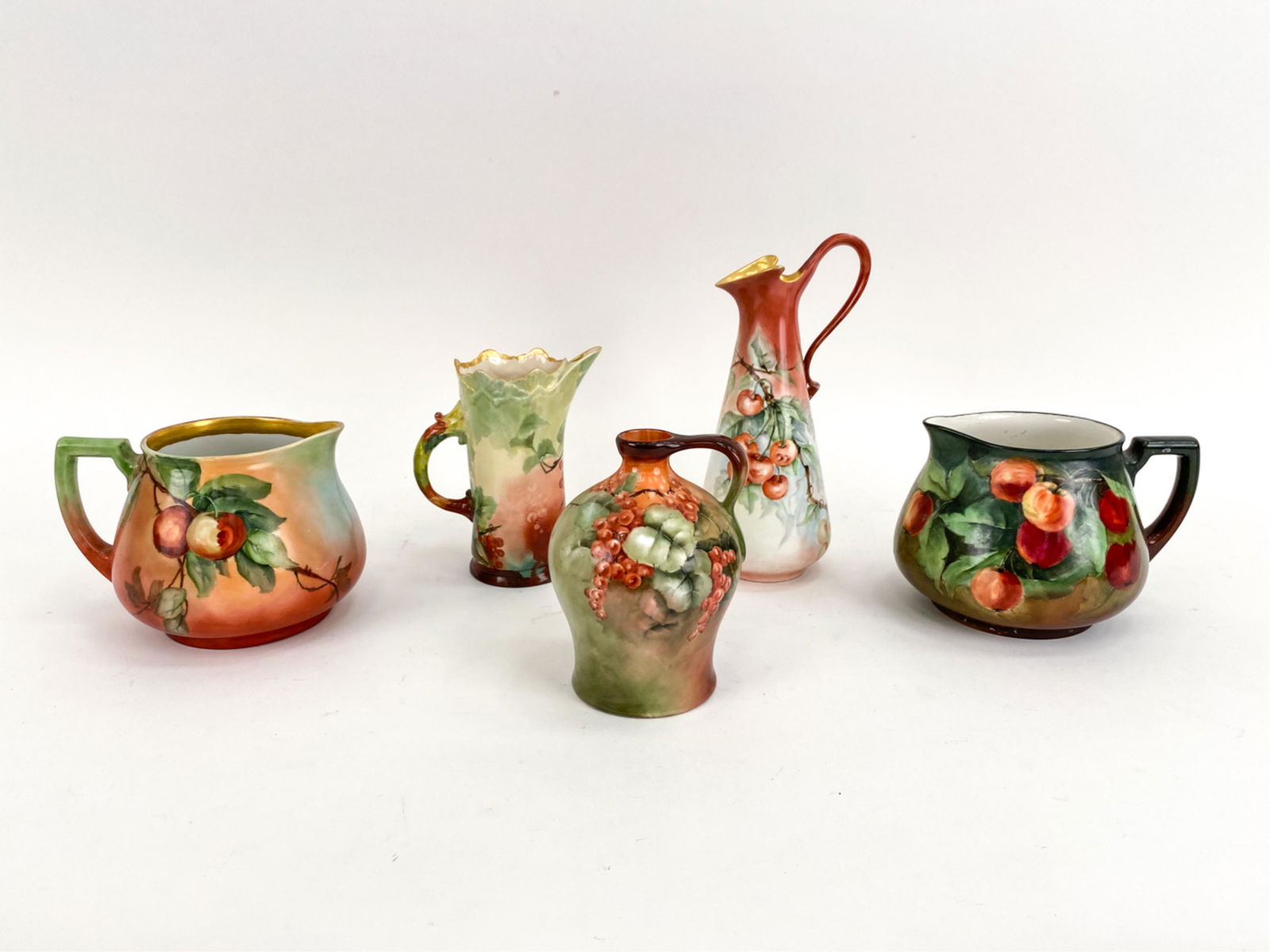 (5) BAVARIAN ANTIQUE PORCELAIN VESSELS: All hand-painted, with floral and fruit designs. Marked underneath. Dimensions: (Tallest) H 12" x Dia. 4" Condition: Some surface dirt. Some rubbing to the two with gold.