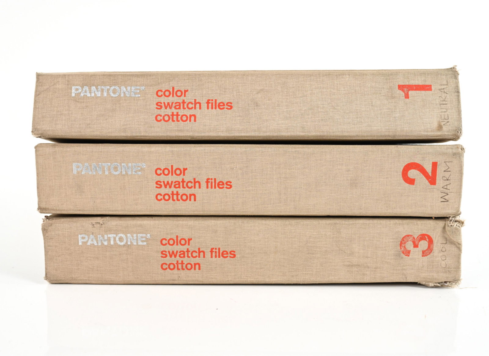 (3) VOLS. PANTONE COTTON COLOR SWATCH FILES, 2003: (3) Volumes Pantone Color Swatch Files For Fashion and Home (2003) with removable cotton swatches. Dimensions: (Each) H 14.5" x W 2.75" x D 13.5" Condition: Wear consistent with age and use; apparentl