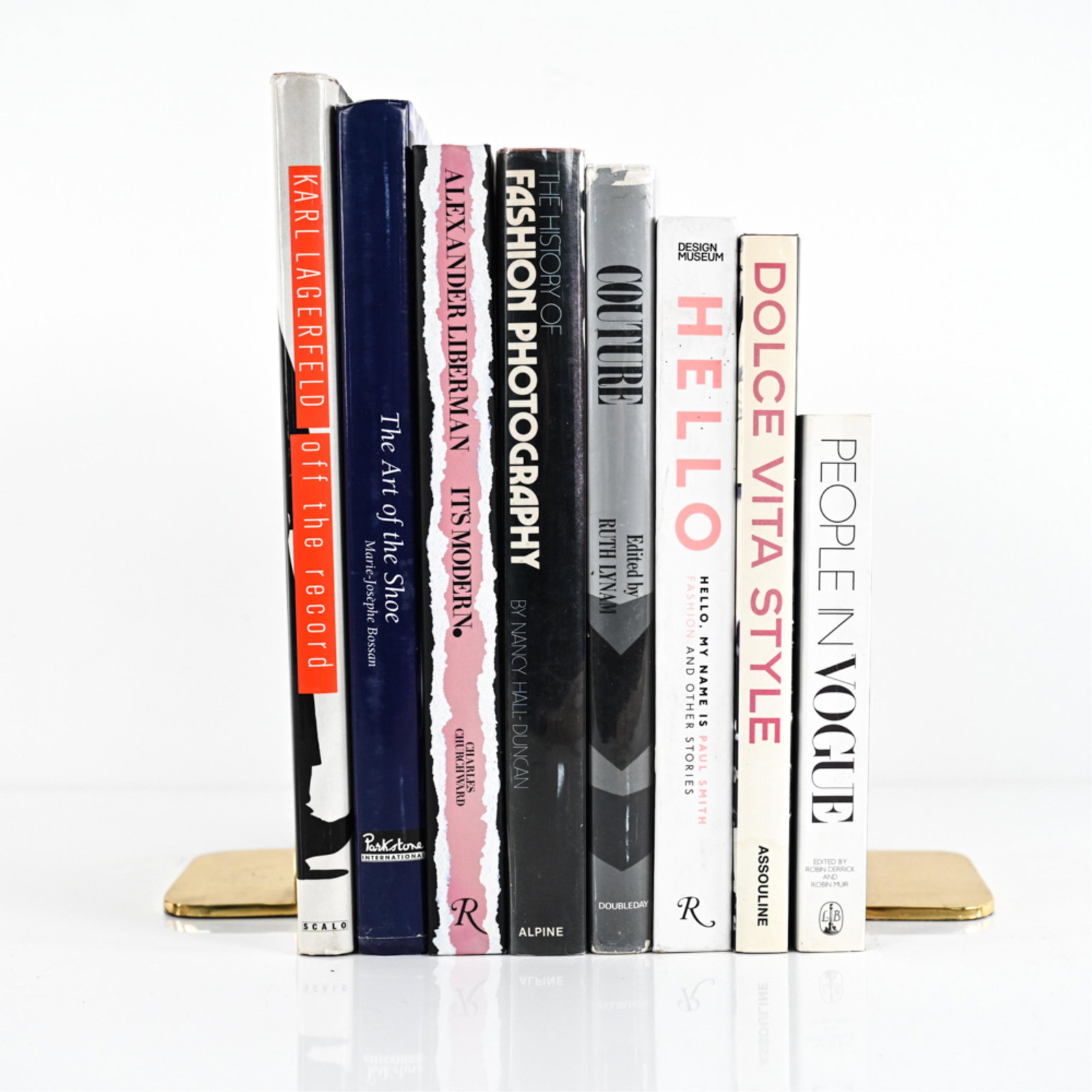(8) GROUPING OF FASHION BOOKS: Small grouping of fashion books ranging from Karl Lagerfeld to Alexander Liberman. Dimensions: (Total linear width) H 13.25" x W 8.75" x D 10.25" Condition: Wear is consistent with age and use.