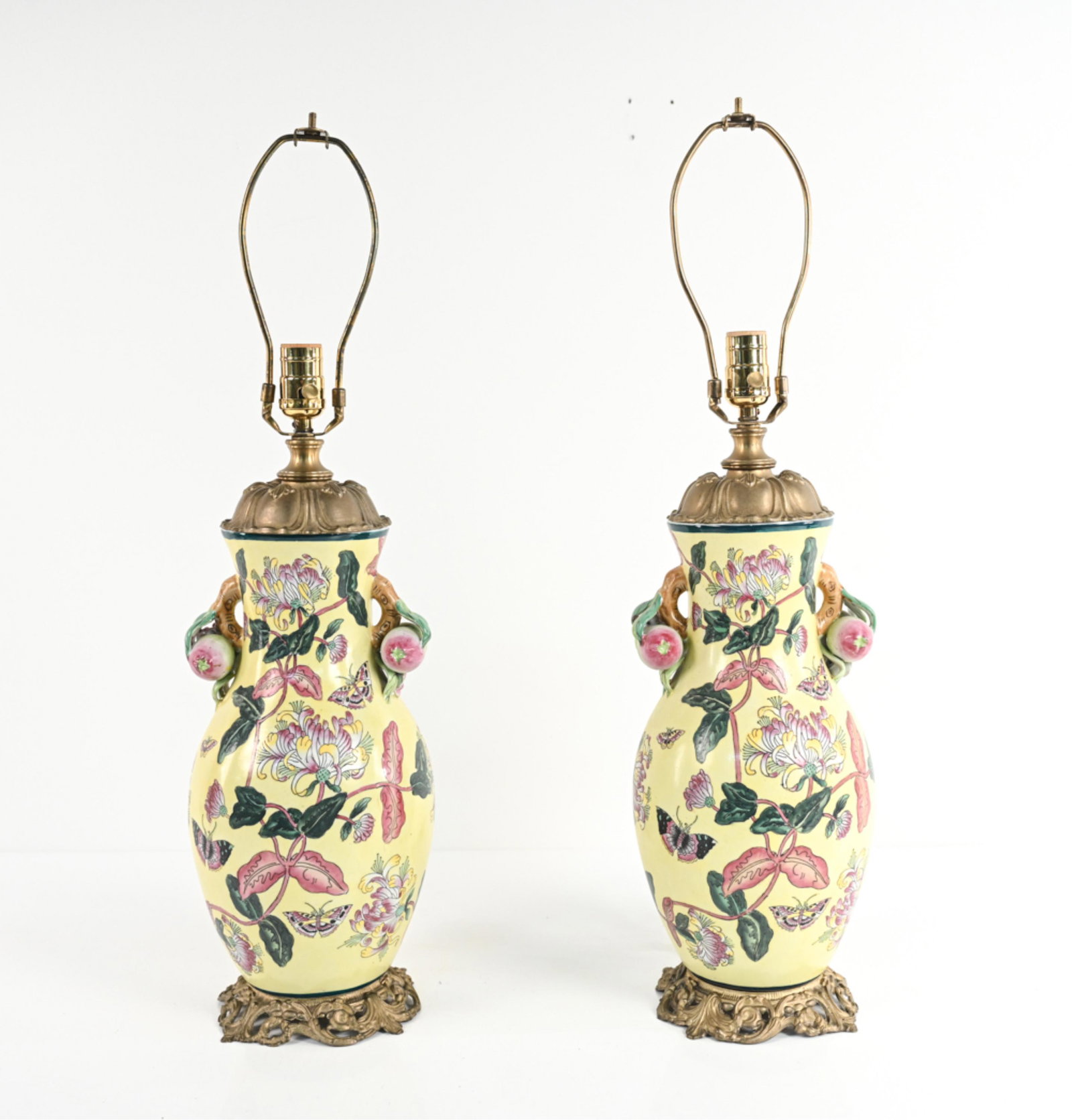 PAIR OF CHINESE PORCELAIN VASES, AS LAMPS: With gilt metal mounts. Dimensions: H (to socket) 21.5" x Dia. 9" Condition: Wiring not tested; a few light surface rubs, some patina to metal mounts.