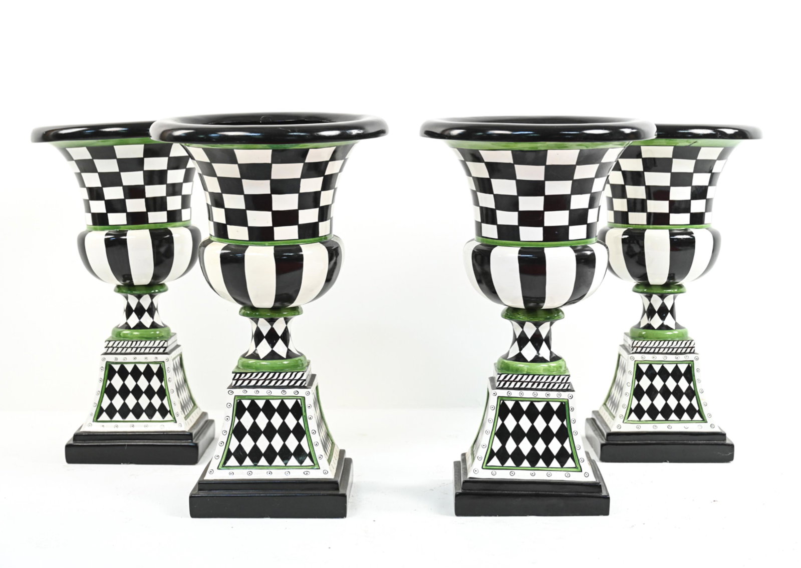 (4) MACKENZIE CHILDS-STYLE URN PLANTERS: (4) urn-form pedestal planters, marked "Made in Phillipines" underneath. Painted composite. Dimensions: H 26.25" x Dia. 16.25"Condition: Wear consistent with use. Few scuffs and small paint chips. Few