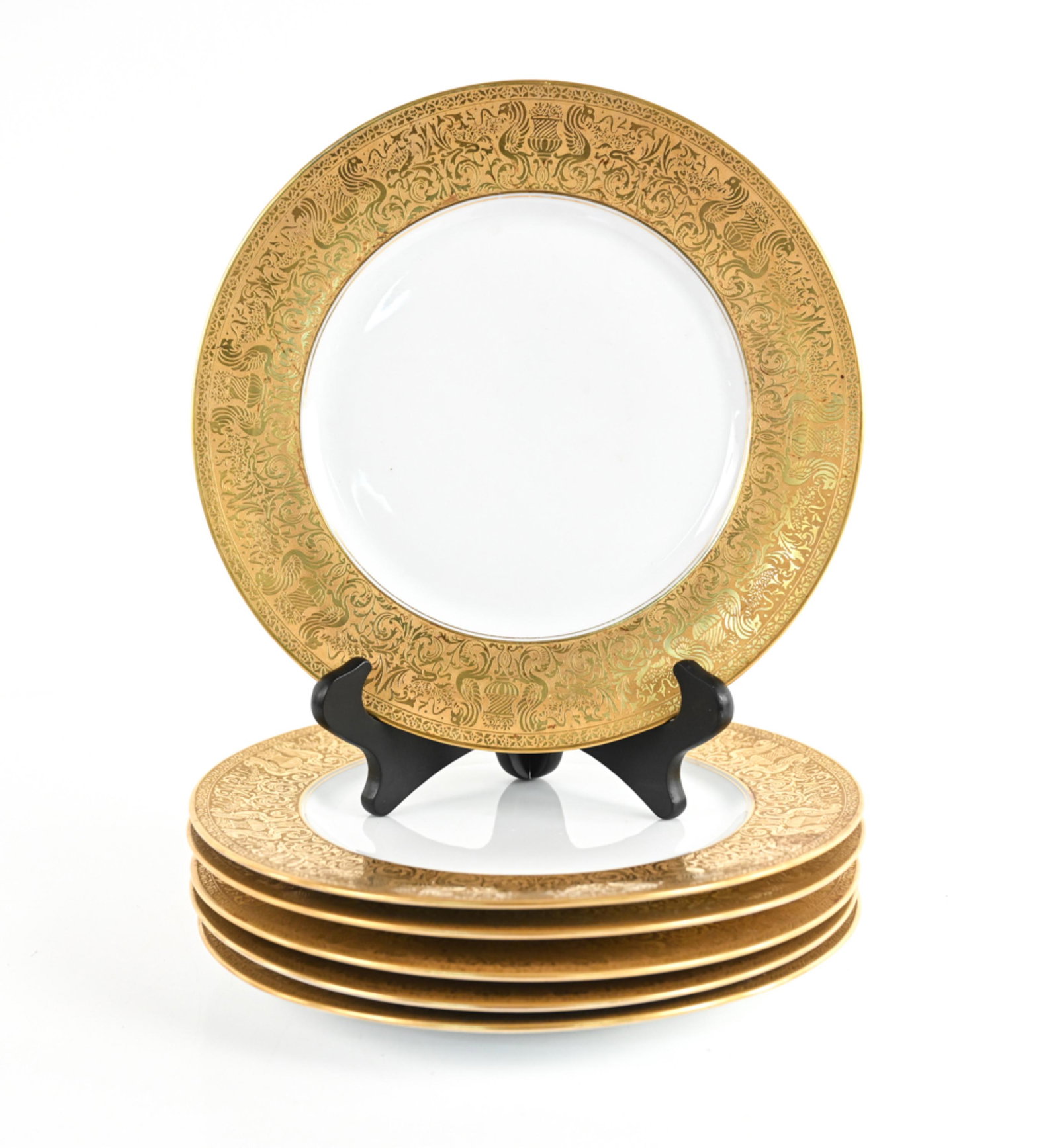 (6) HEINRICH GILT PORCELAIN DINNER PLATES: Heinrich & Co. Bavarian porcelain. Dimensions: H 1" x Dia. 10.75" Condition: A few spots of patina and rubbing to gilding; a couple faint knife marks.
