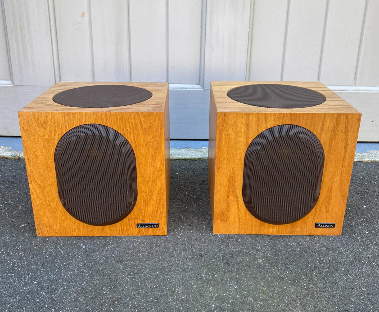 PAIR OF ALLISON CD-6 SPEAKERS: Marked to front. Serial no. F-34216 and F-33895. Dimensions: H 12.25" x W 11.25" x D 10" Condition: One with some damage to speaker grille cover. Wear consistent with use. Few surface marks.