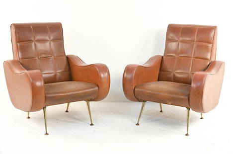 MANNER OF GIGI RADICE VINYL CLUB CHAIRS: Sculptural armchairs in quilted vinyl, on brass legs. Apparently unmarked, c. 1950's-1960's. Dimensions: H 35.5" x W 29" x D 33" x SH 14" Condition: Vinyl with scattered nicks and small tears and sepa