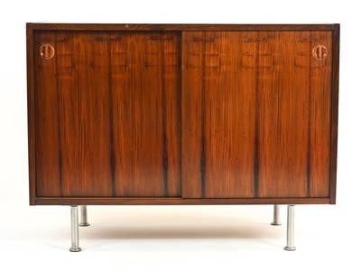 MANNER OF KAI KRISTIANSEN ROSEWOOD BUFFET CABINET: Small buffet or credenza in bookmatched rosewood, on brushed chrome legs. Apparently unmarked, in the manner of Kai Kristiansen for Feldballes Mobelfabrik, c. 1960's. Dimensions: H 30" x W 39.5" x D 1