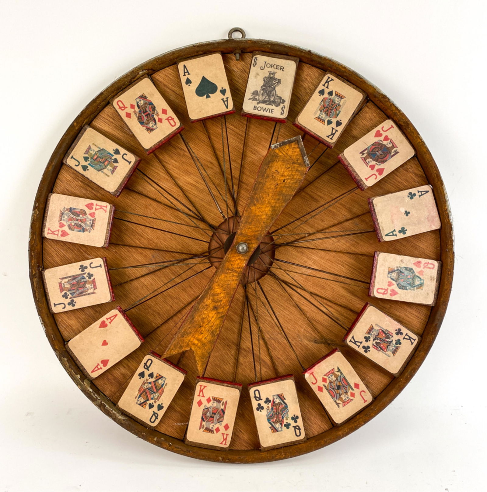 ANTIQUE-STYLE BETTING WHEEL: Photo-lithographed cards placed on bicycle spokes. With wooden spinner and wood backing. Dimensions: Dia. 24" x D 4.5" Condition: With intentional aging/antiquing.