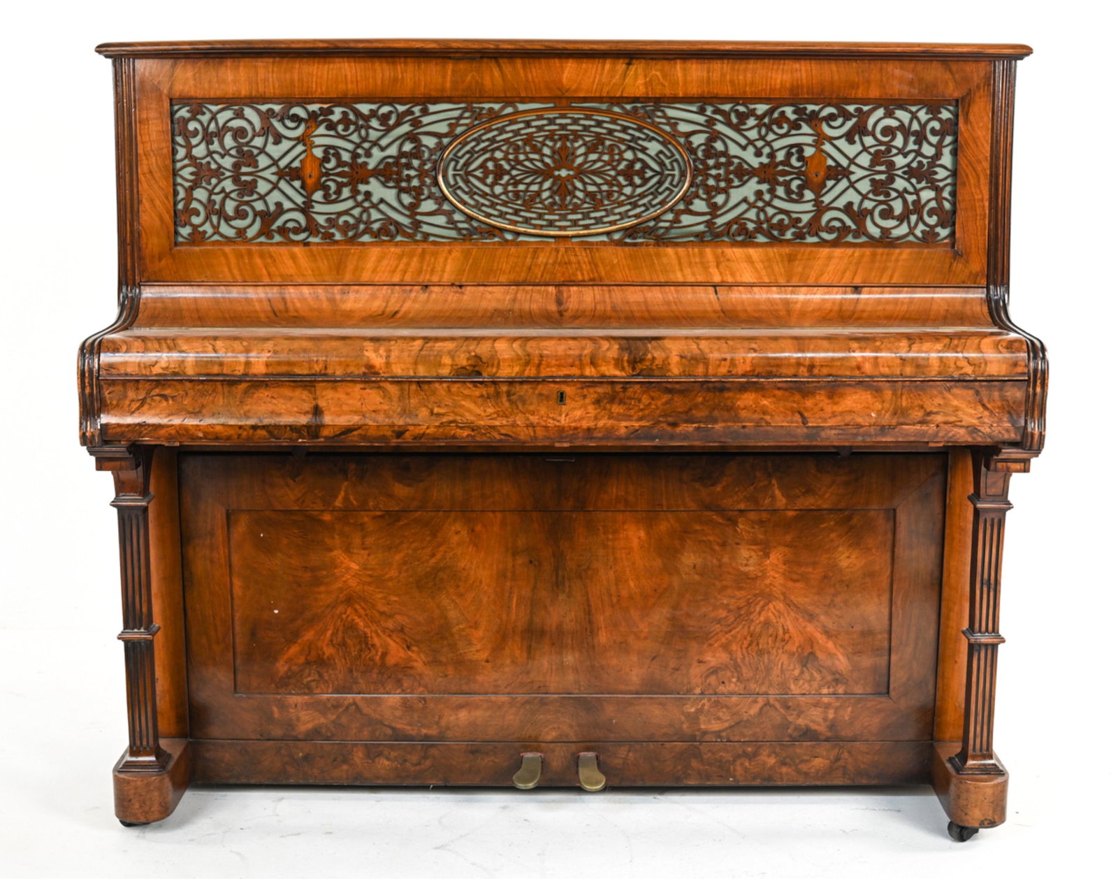 WM. DREAPER ENGLISH VICTORIAN UPRIGHT PIANO: 19th Century upright piano with beautiful wood veneers and a very intricate decorative fret panel in the front. Dimensions: H 47" x W 55" x D 24" Condition: Wear is consistent with age and use.