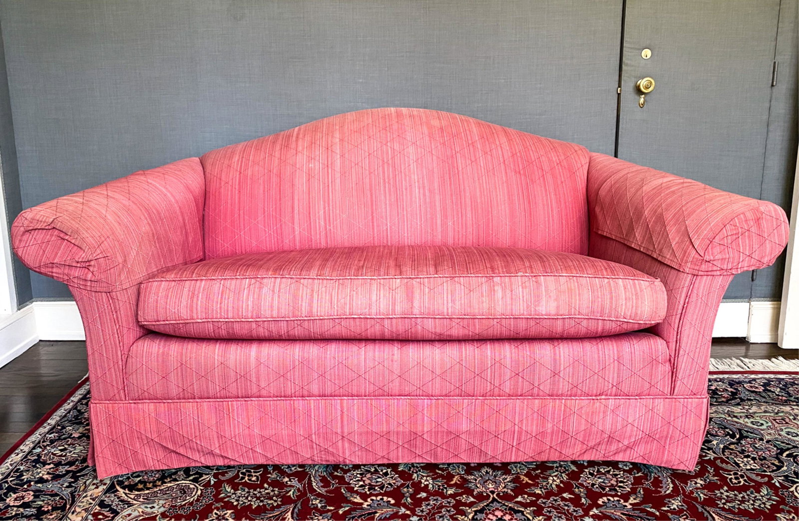ROLLED ARM LOVESEAT: No labels. Dimensions: H 33" x W 66" x D 35" x SH 19" Condition: Heavy sun fading; in need of re-upholstery. Some soiling. Small hole to upholstery on front seat edge.