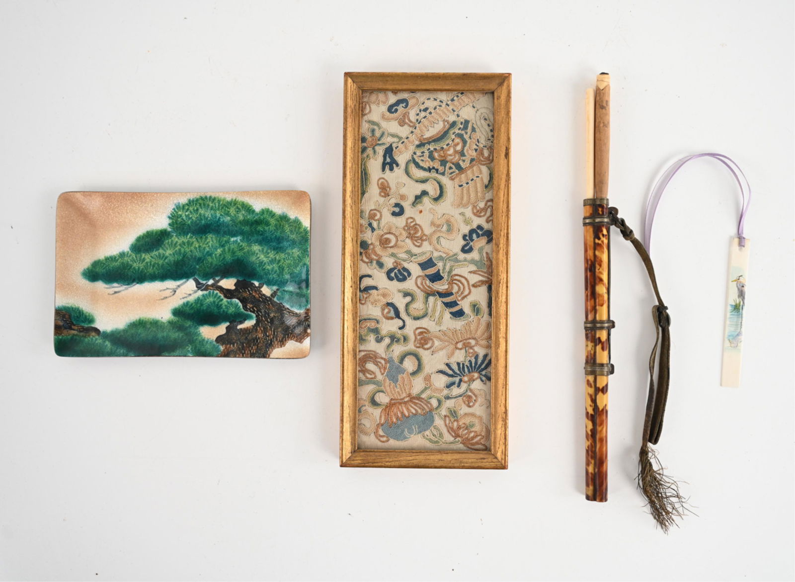 JAPANESE DECORATIVE GROUPING: (4) pieces including small embroidery; enamel tray of Bonsai tree, with label underneath; small painted bookmark or plaque of heron; and bone chopsticks and knife in holder. Dimensions: (Embroidery fr