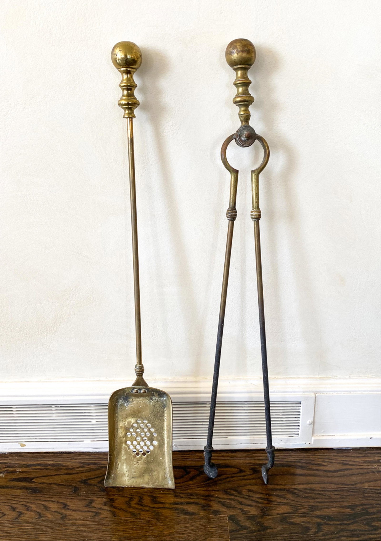 BRASS FIREPLACE TOOLS: Including shovel and tongs. Dimensions: (Tongs) H 30.5" x W 3.5" Condition: Wear consistent with use including some tarnish and corrosion.