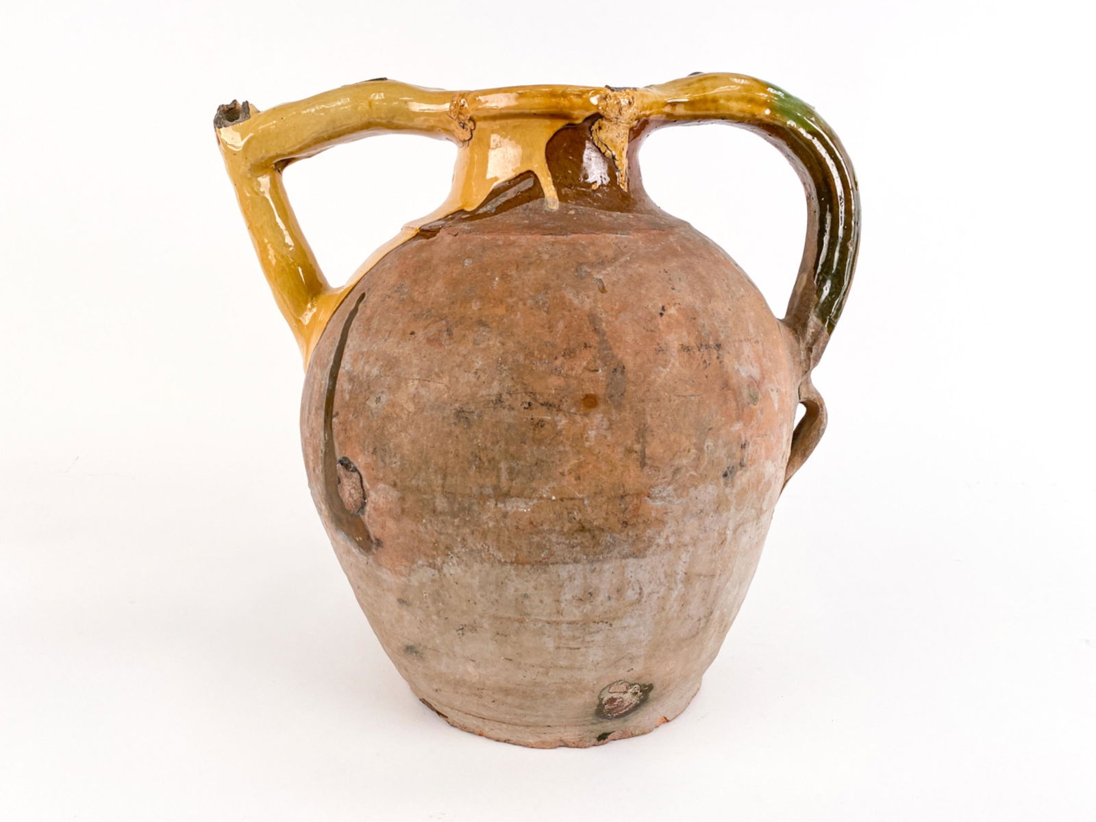 FRENCH ANTIQUE RARE ORJOL MUSTARD GLAZED POTTERY: A rare museum-quality 18th century orjol in terre vernissee. Yellow-mustard glaze applied in "bavette" design. These were only made to order ("sur mesure"). Dimensions: H 15.5" x W 15.75" x D 12" Cond