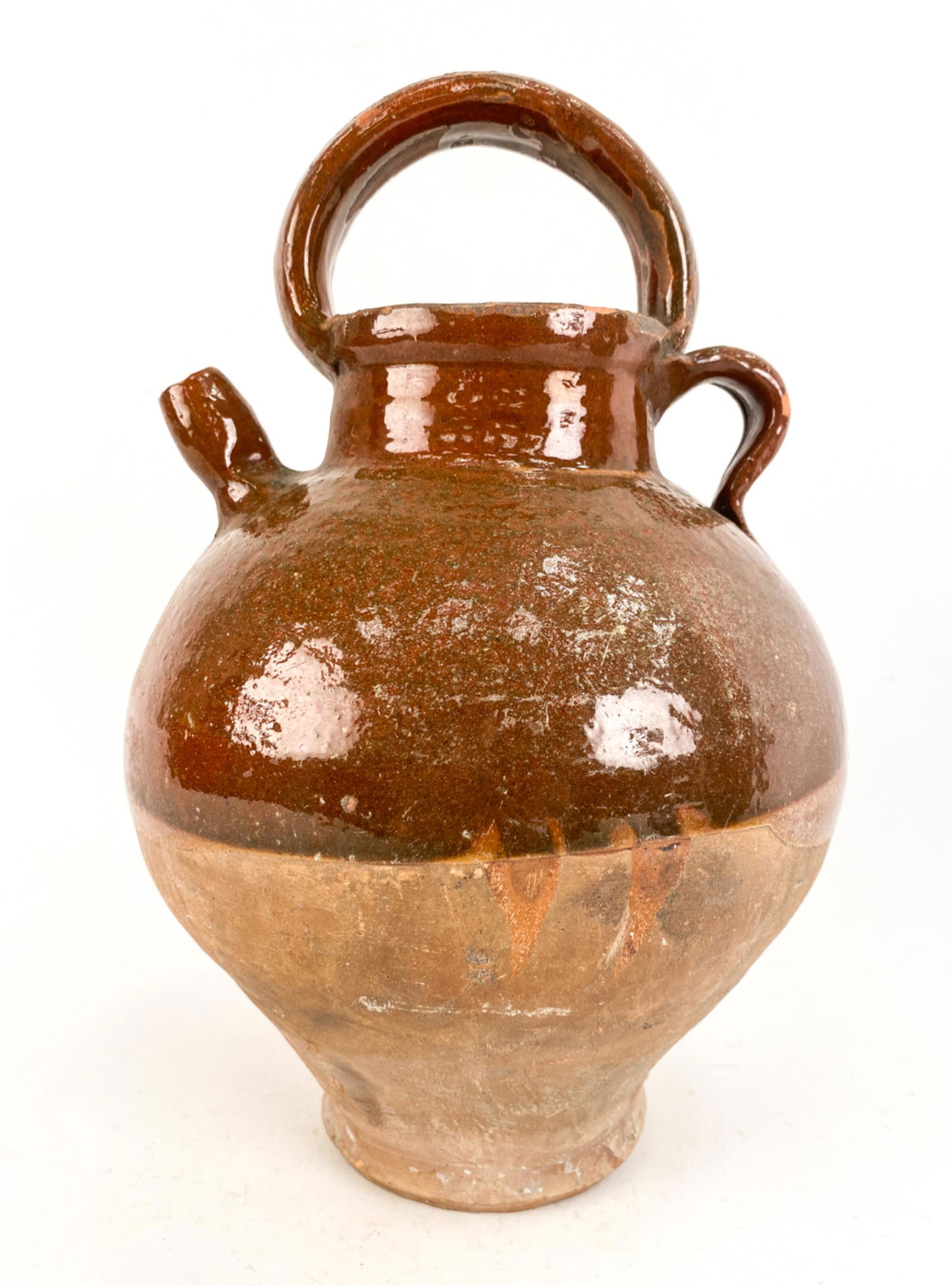 18TH C. FRENCH ANTIQUE EARTHENWARE CRUCHE: Half-glazed Provencal cruche. Brick-caramel color with thin streaks of green. Aubagne, Provence. Dimensions: H 13.25" x Dia. 8.5" Condition: Chips and glaze losses. Surface scratches. Crazing.