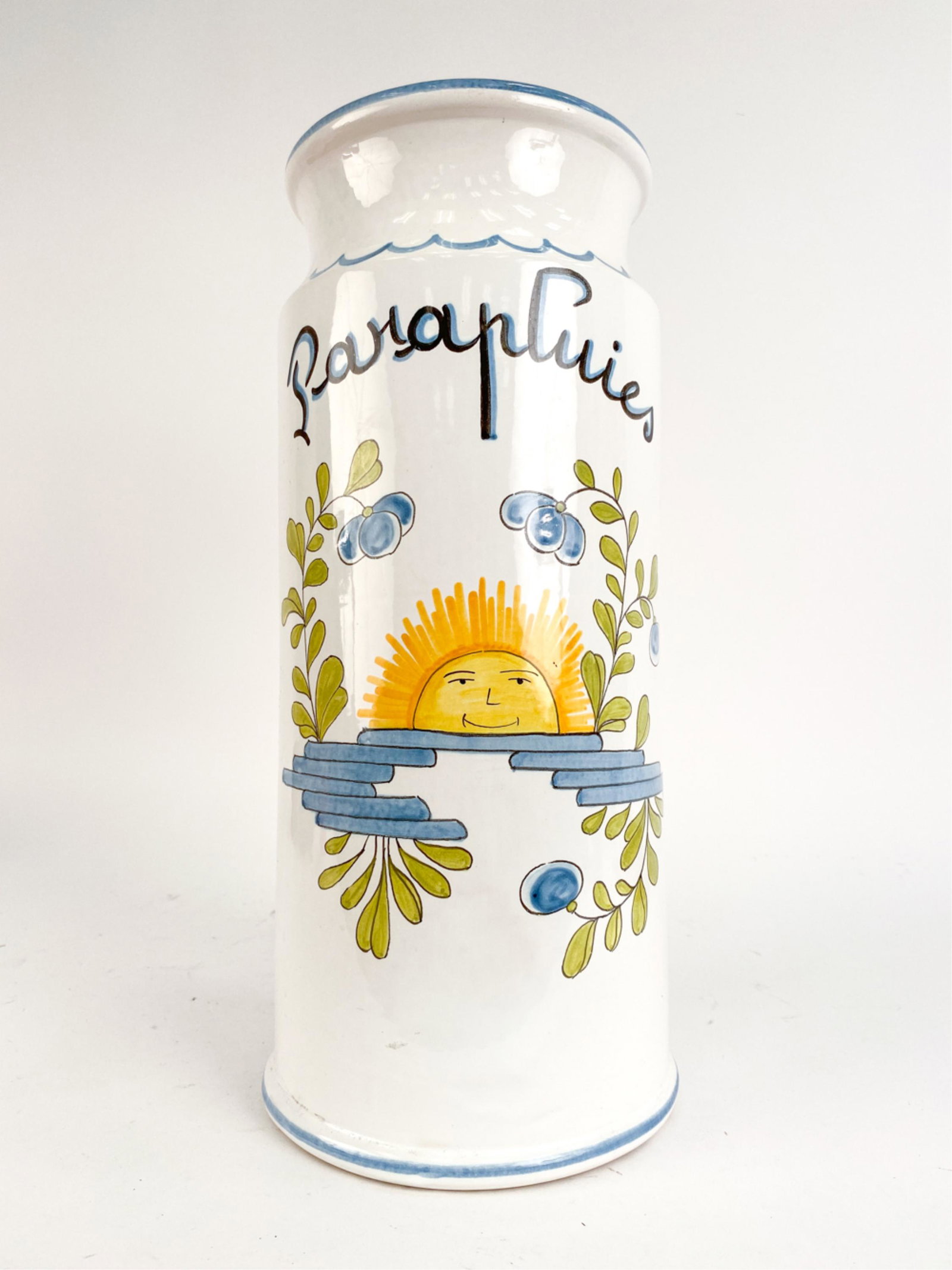 VINTAGE FRENCH PIERRE DEUX UMBRELLA STAND: Late 1980's umbrella "Parapluies" stand with design. Signed underneath. Dimensions: H 19.5" x Dia. 8.25" Condition: Chips and small cracks to glaze at top rim. Light wear consistent with use.