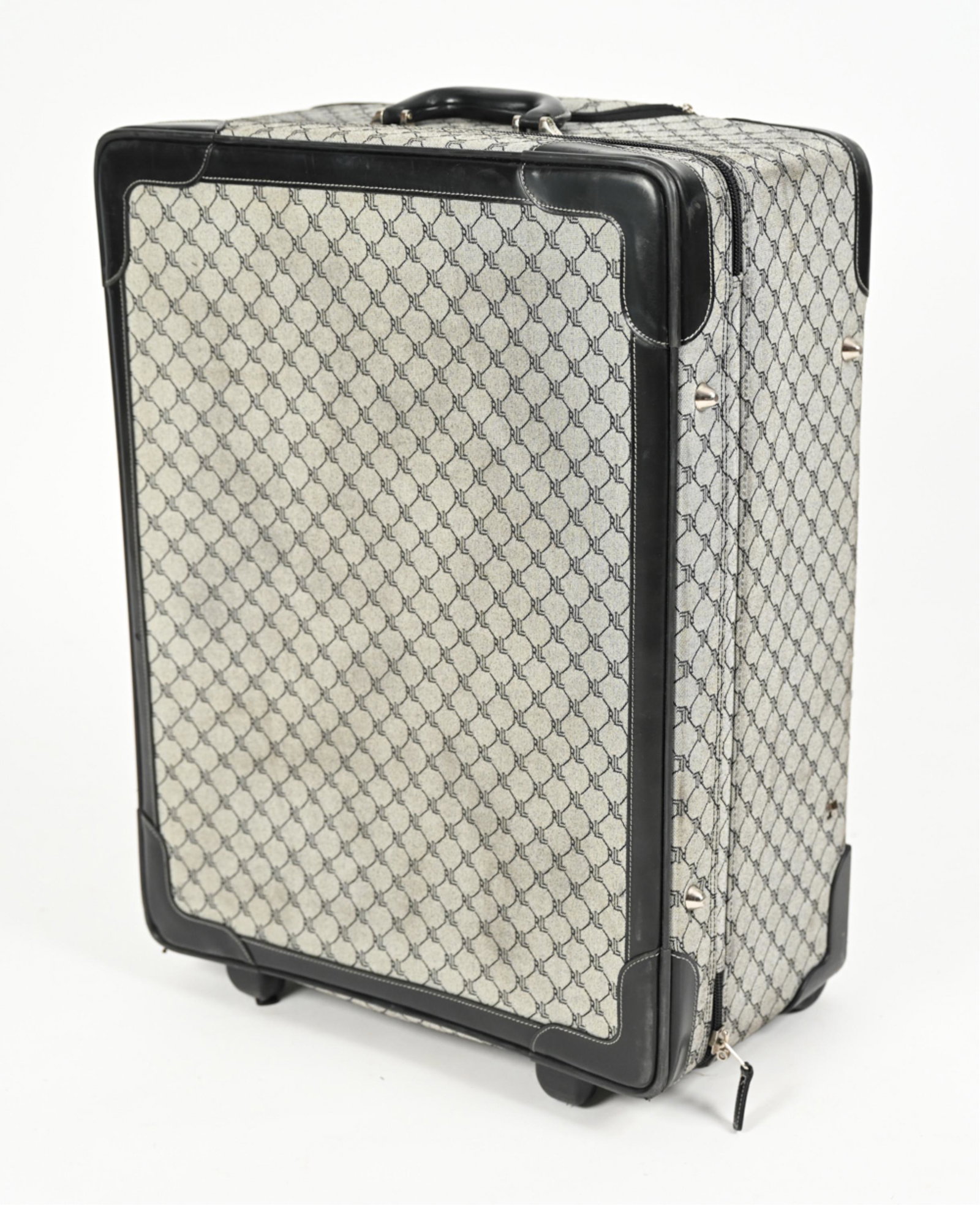 RALPH LAUREN LUGGAGE: Ralph Lauren luggage with tag inside. Interior with multiple pockets. Dimensions: H 26" x W 18.5" x D 10.5" Condition: A few spots of light soiling to exterior Missing (1) footcap on side. A few scuff