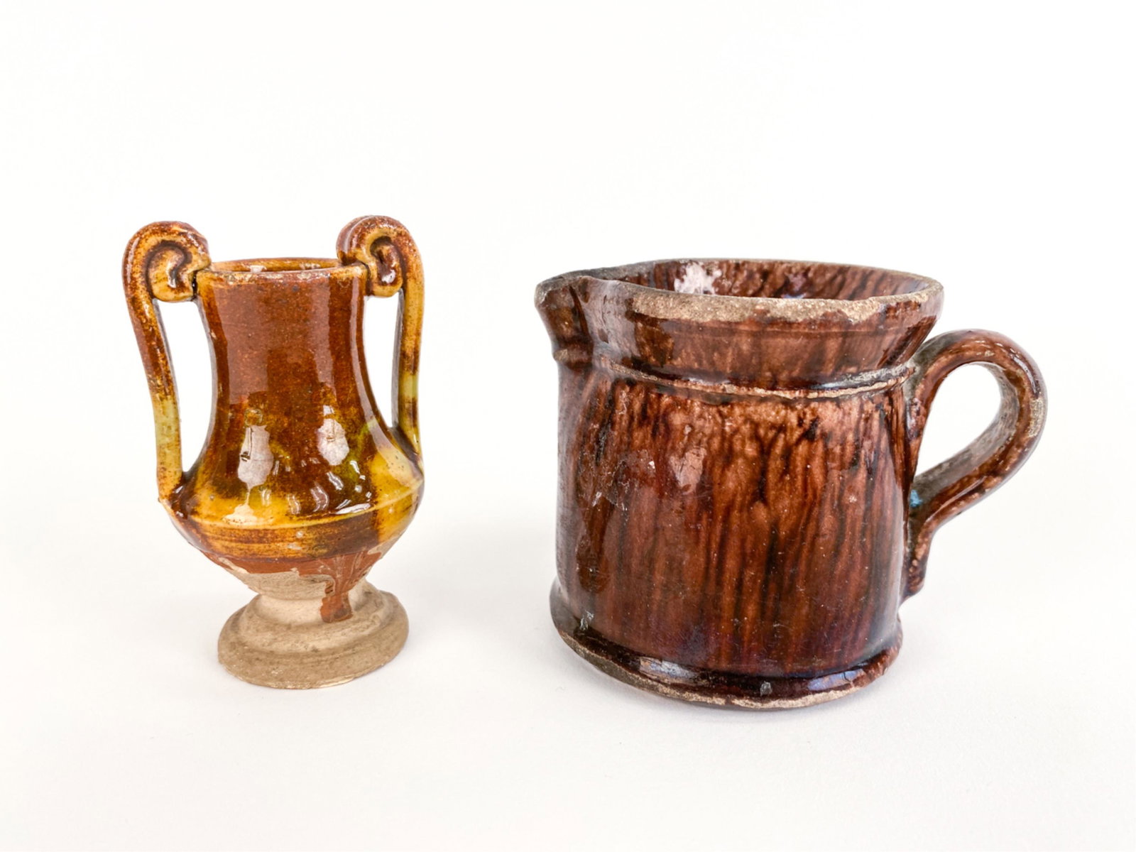 (2) FRENCH ANTIQUE POTTERY POTTER'S SAMPLES: (2) petite sample size poteries. Dimensions: (Larger) H 2.75" x W 3.75" x D 2.75" Condition: Few chips, glaze losses, and crazing. Scratches and surface wear consistent with age and use.