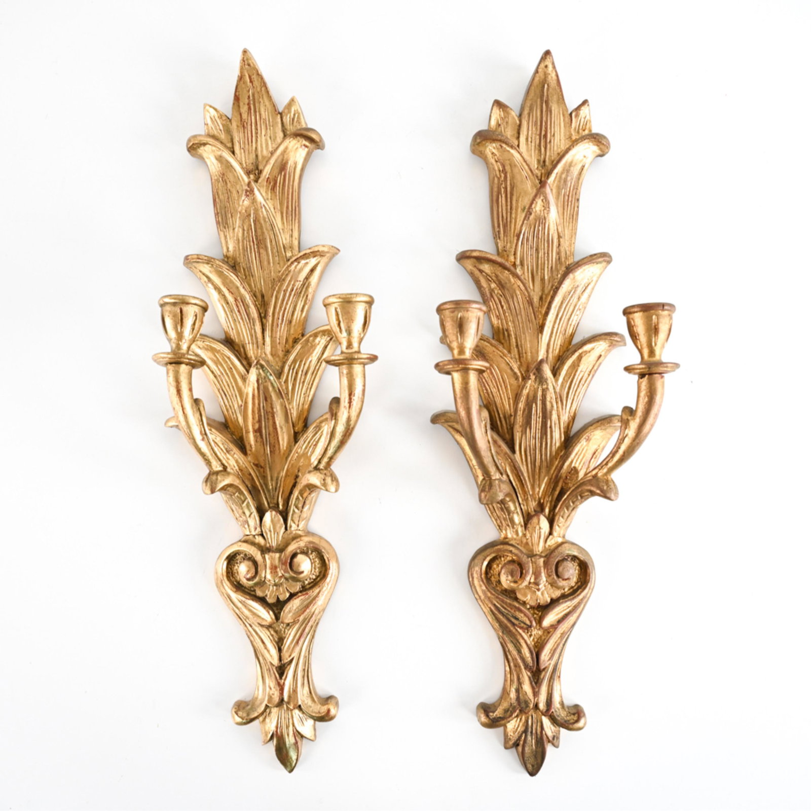 PAIR OF 20TH C. GILTWOOD CANDLE SCONCES: Dimensions: H 25" x W 8" x D 4.5" Condition: Apparent repaired breaks to (2) arms (where they connect to the plaque) and (2) candle cups (where bobeches connect to arms). Intentionally antiqued finish
