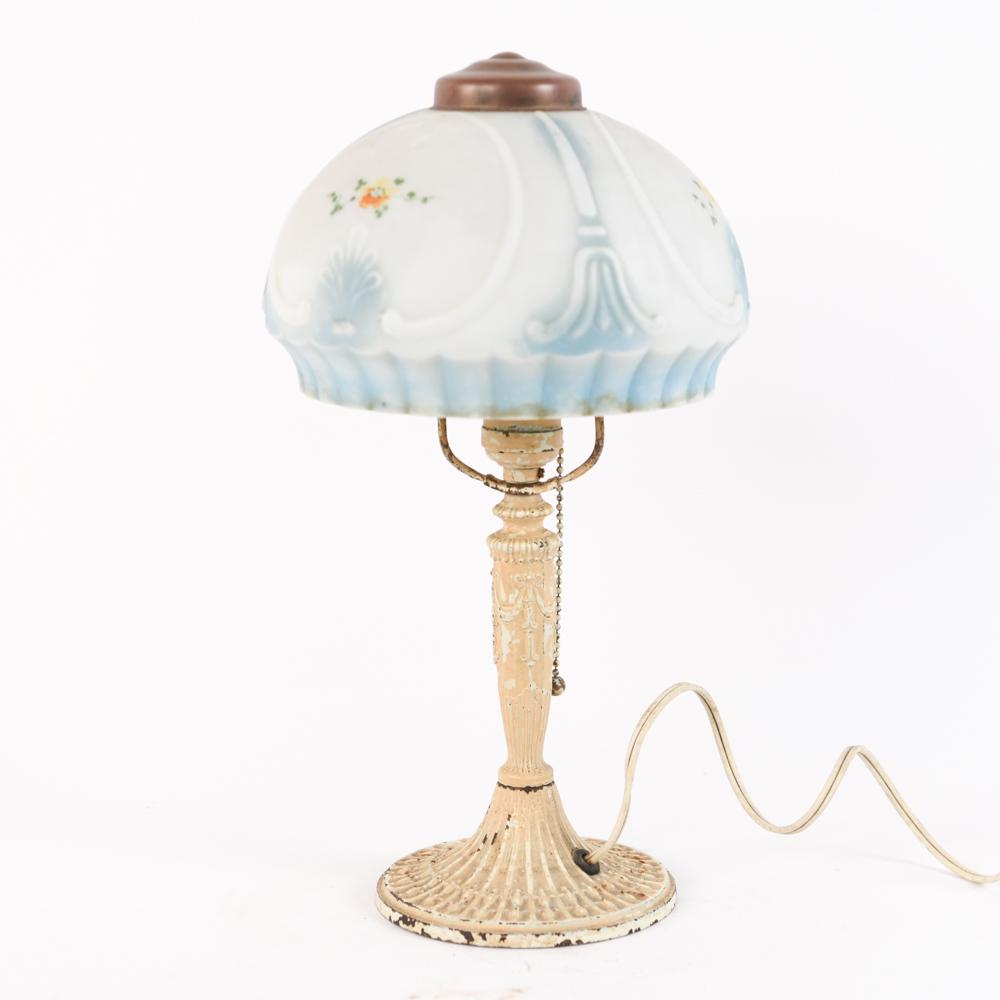 ANTIQUE REVERSE-PAINTED PUFFY BOUDOIR LAMP: Apparently unmarked, with painted cast iron base. Dimensions: (With shade) H 14.5" x Dia. 8" Condition: Wiring not tested. Showing normal wear consistent with age and use; rubbing and losses to paint,