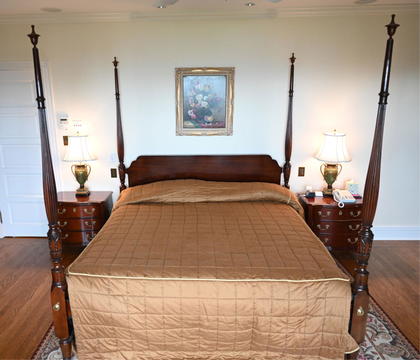 CONTEMPORARY MAHOGANY FOUR-POSTER BED: Fluted and tapered posts with urn-form finials. Dimensions: H 89.5" x W 82.5" x D 89.5" Condition: Wear consistent with use including some nicks, dings, rubs. Edge wear. Few small losses to wood.