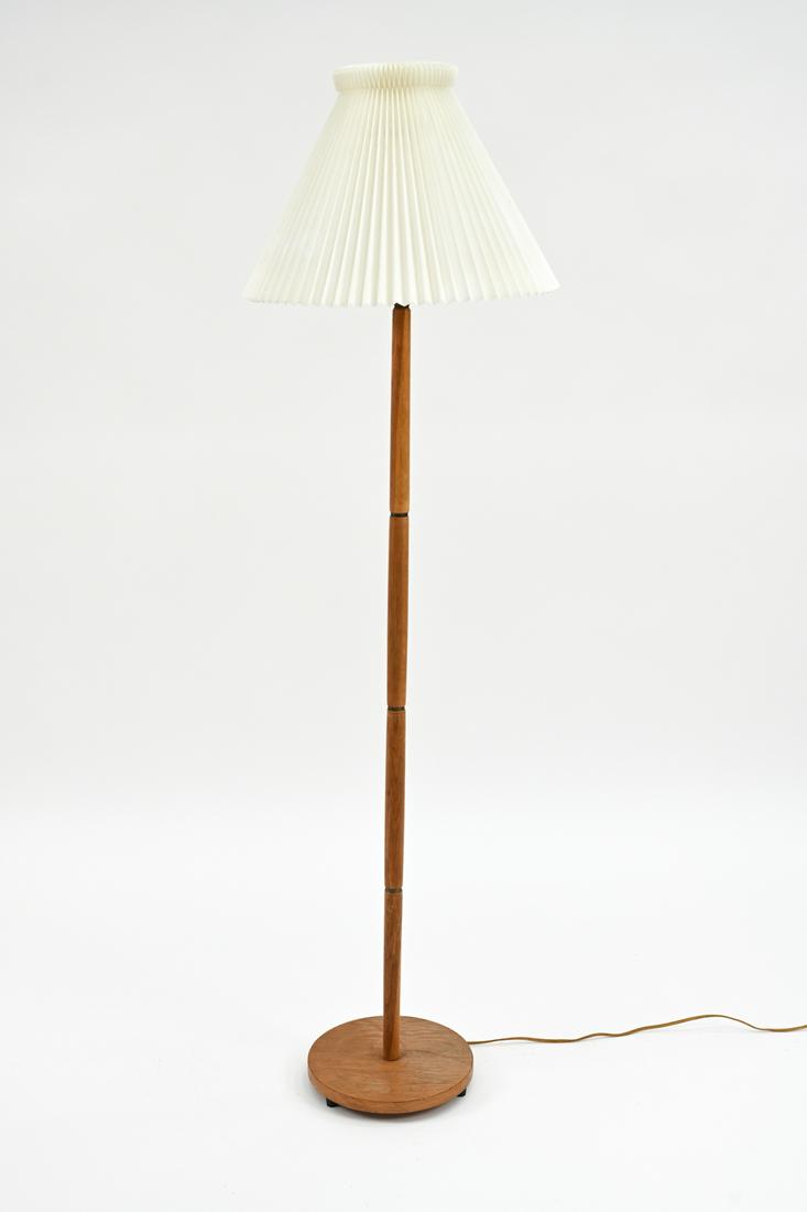 LE KLINT DANISH MID-CENTURY FLOOR LAMP: A Danish mid-century floor lamp in oak with brass ring details, pleated shade. No labels. Dimensions: (Incl. shade) H 60" x Dia. 17" Condition: Few specks to shade. In need of rewiring. Some finish we