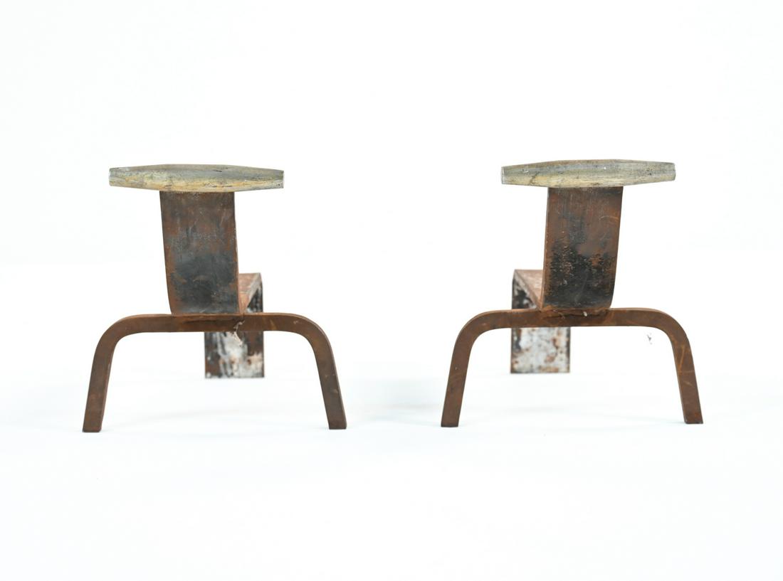 PAIR OF DECO MANNER OF DESKEY ANDIRONS: A pair of unusual Deco andirons in the manner of Donald Deskey. Apparently unmarked. Dimensions: H 12" x W 12.5" x D 18" Condition: Heavy surface rust consistent with use.