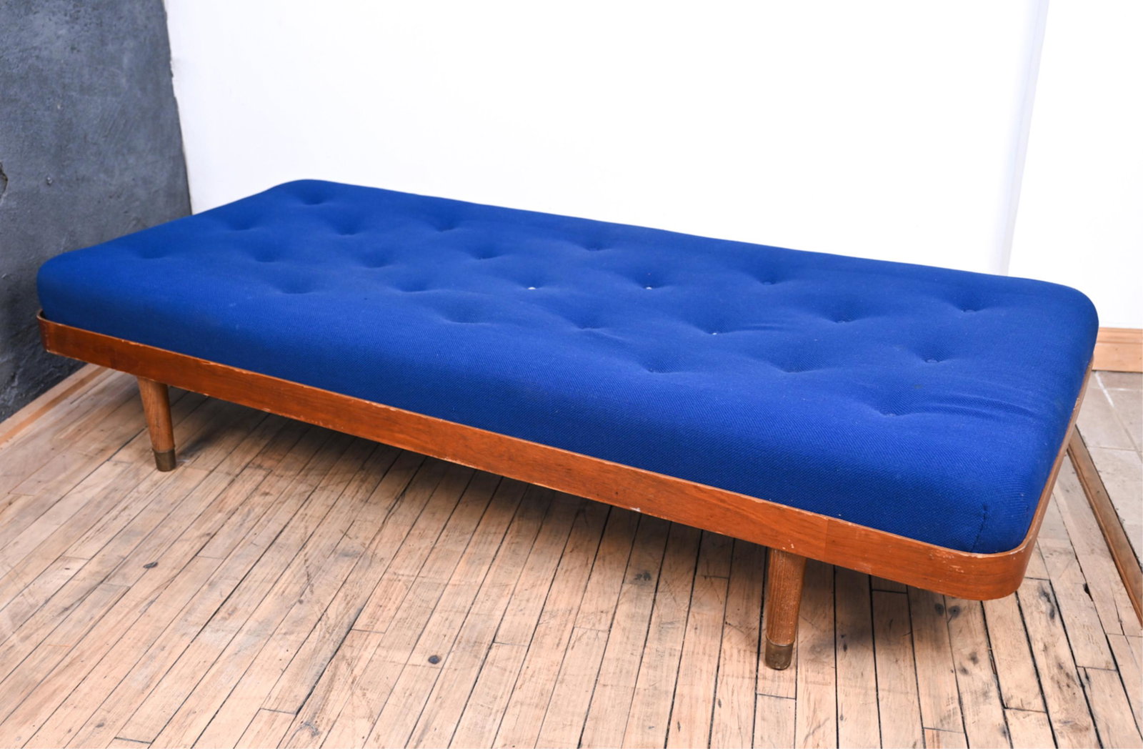 ATTR. HORSNAES MOBLER MID-CENTURY TEAK DAYBED: With tufted royal blue tweed cushion. Dimensions: H 15.5" x W 75.5" x D 34" Condition: Frame with some nicks and scuffs, a few small splits and losses to veneer at edges; a few areas of faint soiling 